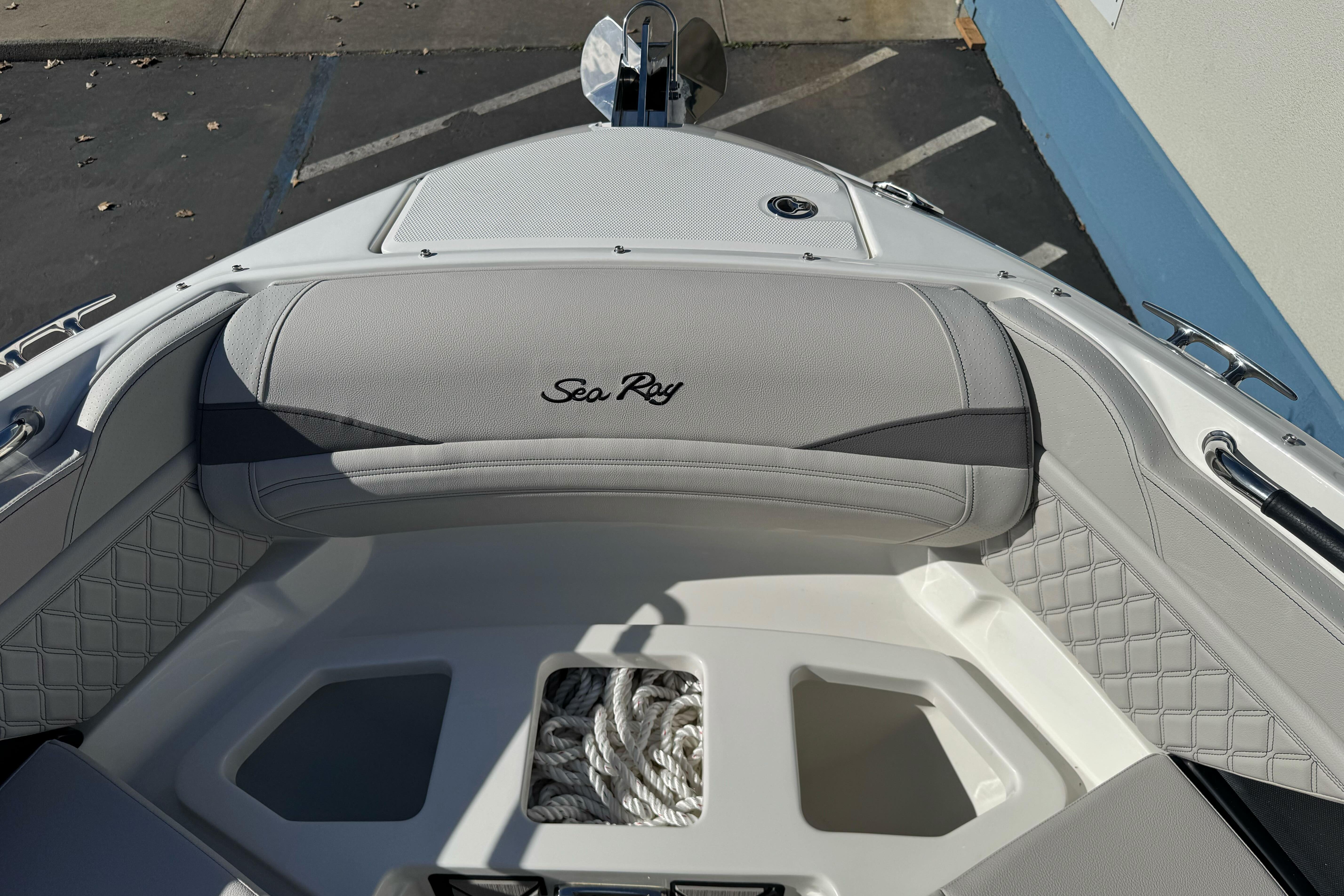 2026 Sea Ray SLX 260 boat interior with elegant seating and storage area.