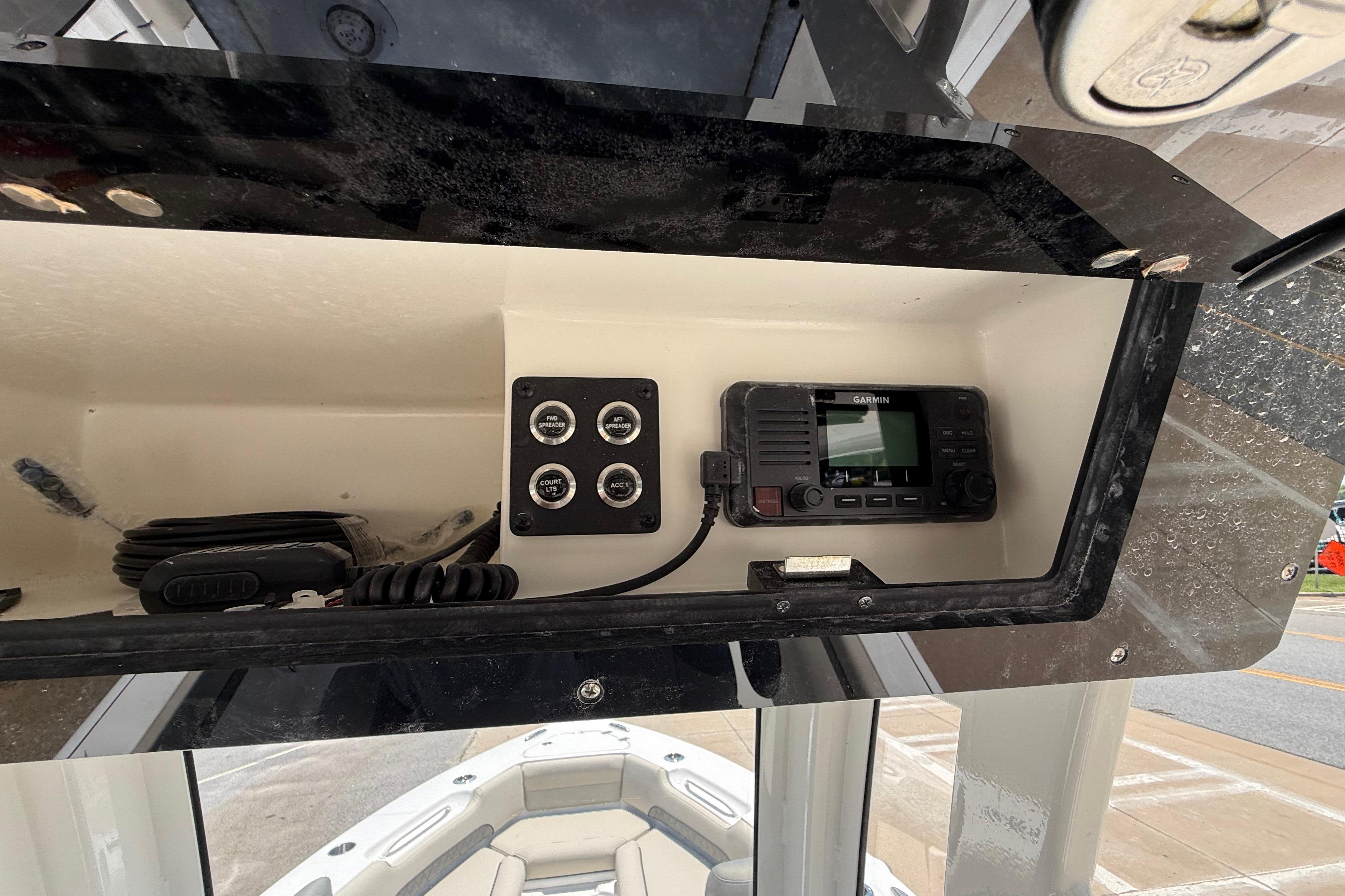 2027 Key West 249 FS boat console with Garmin device and control panel.