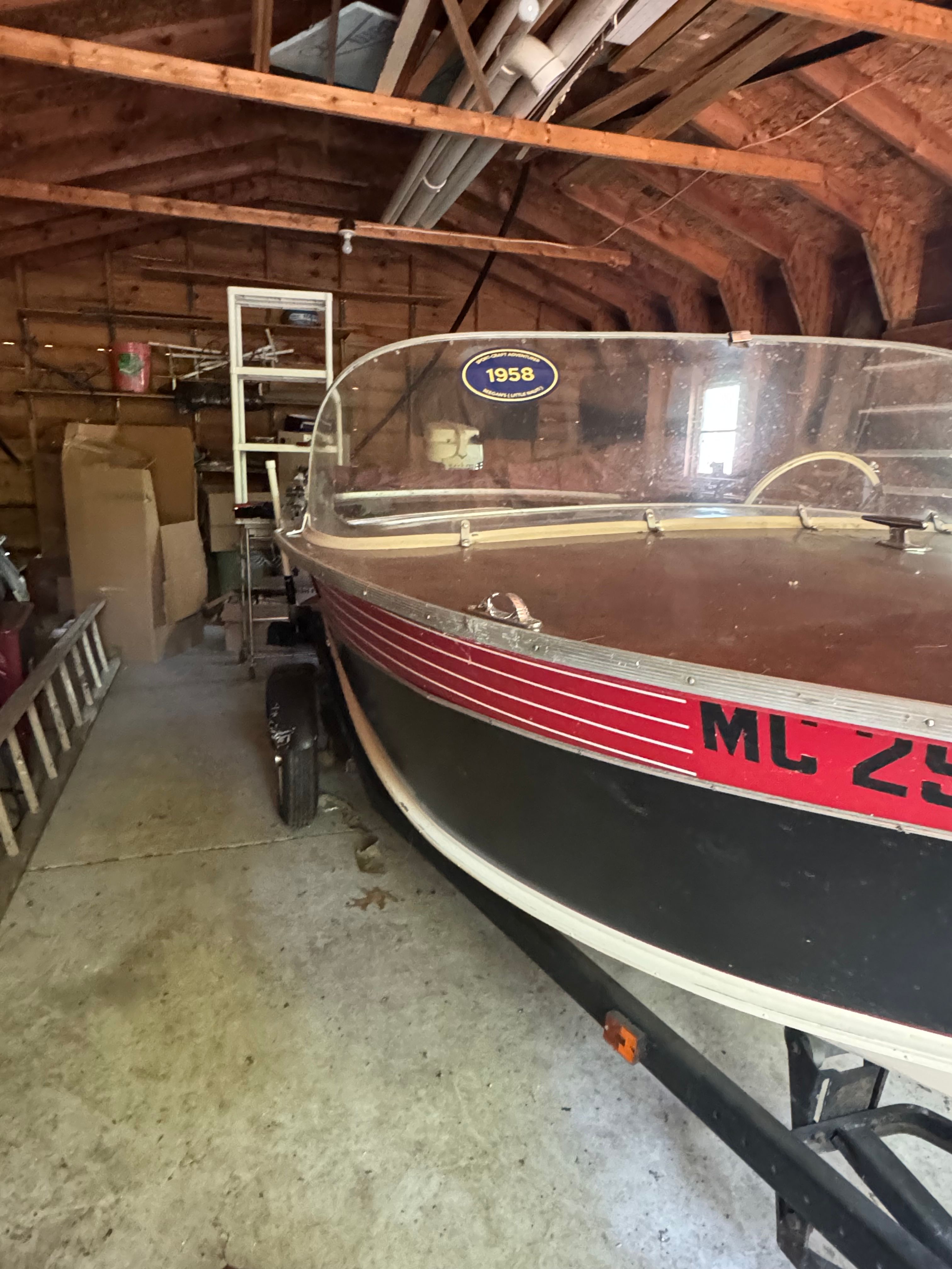 1958 Classic Sportcraft Runabout stored in a barn.