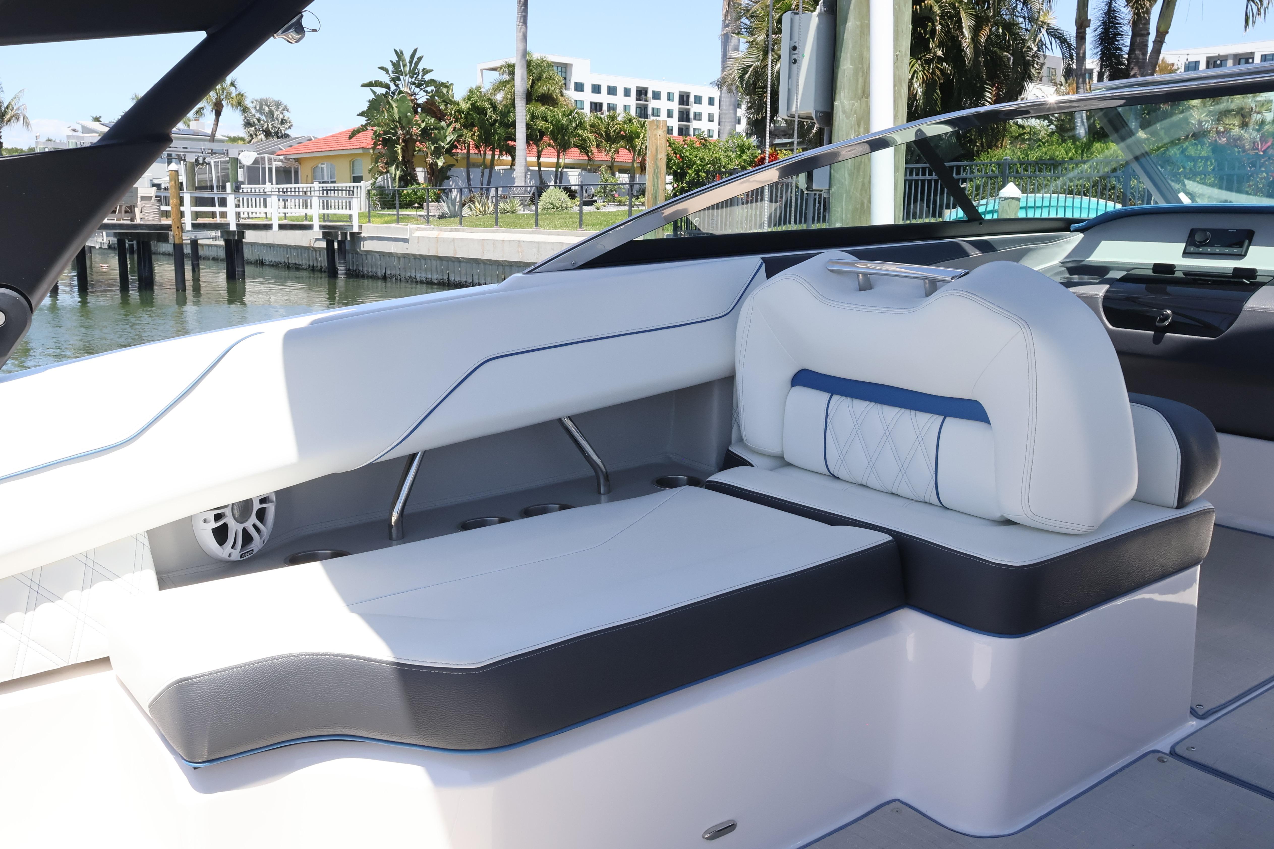 Luxurious interior of a 2020 Regal LX4 boat with white and blue seating.