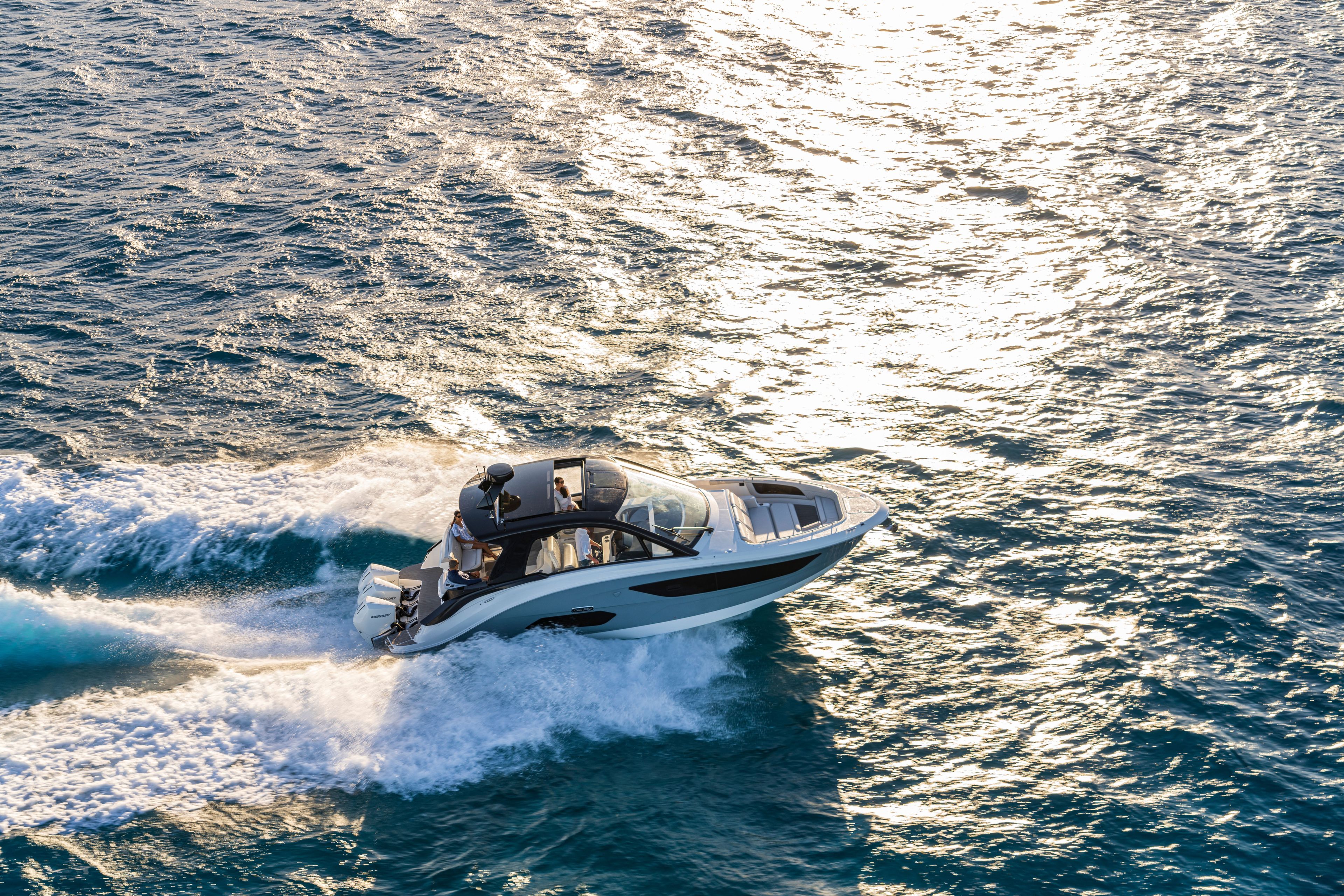 A 2026 Sea Ray Sundancer 370 Outboard speeds across sparkling water.