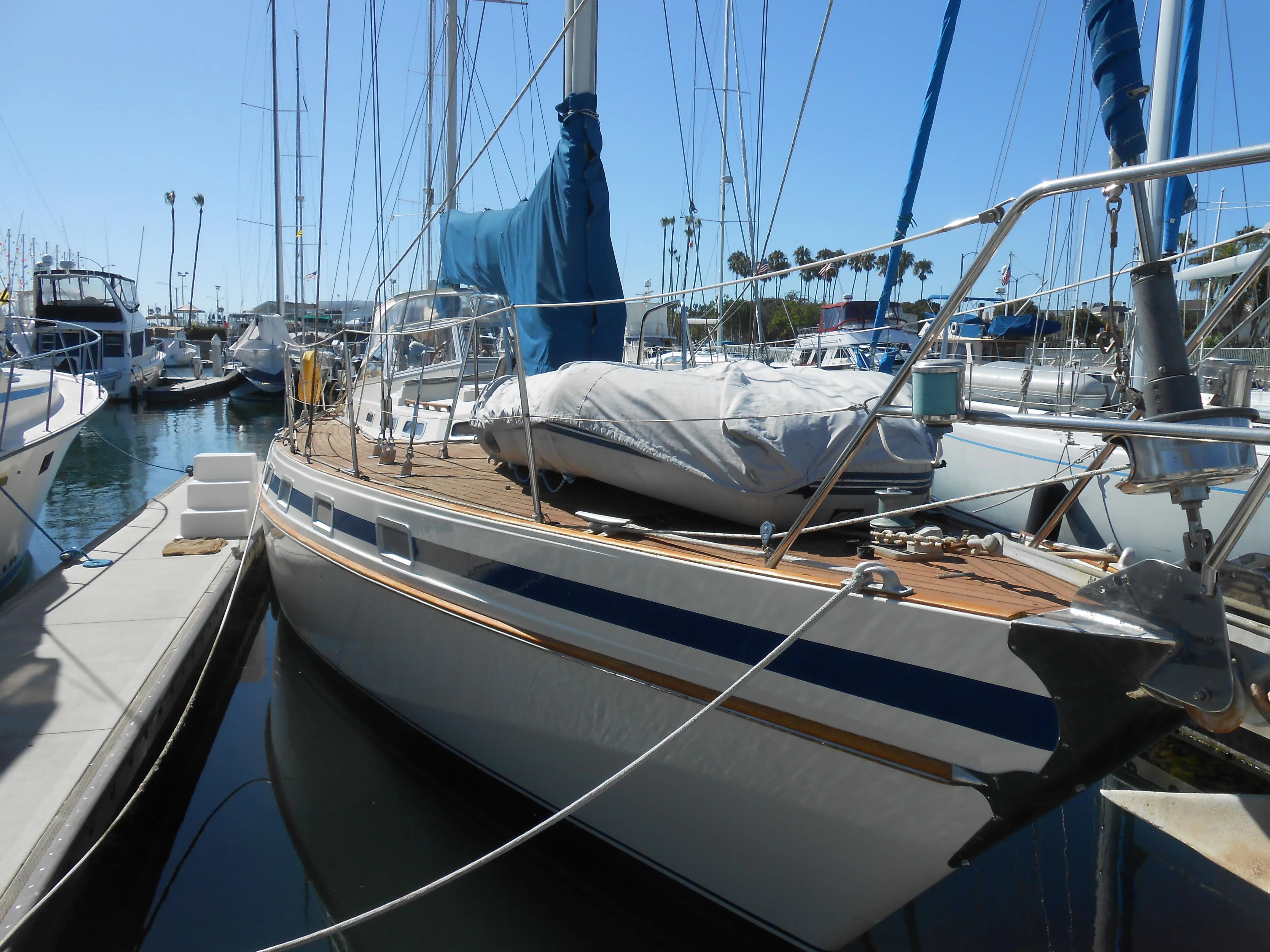 1985 Contest 41 Ketch sailboat docked in marina.