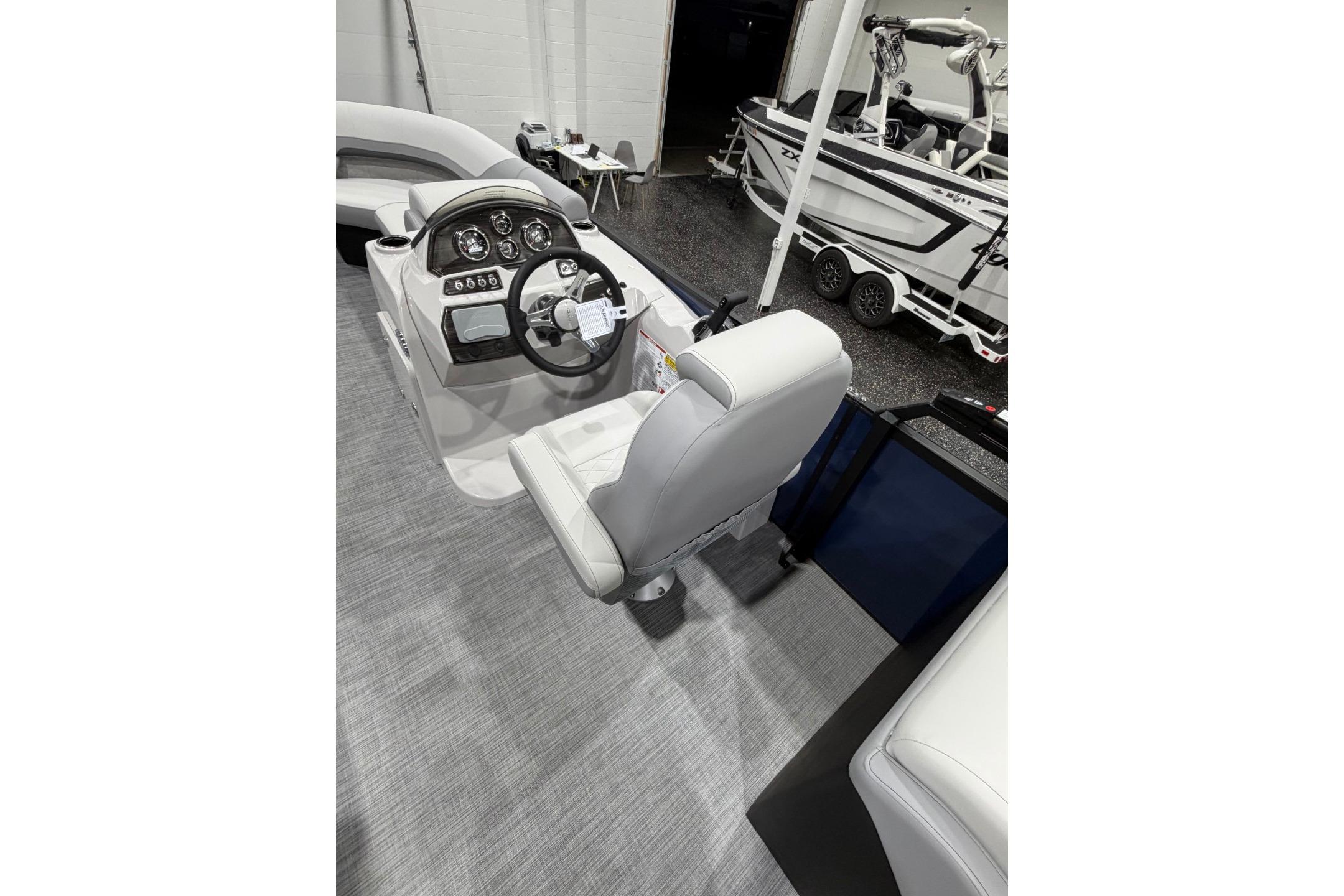 Interior of 2026 Lowe SS 230 WT boat, featuring steering console and seating.