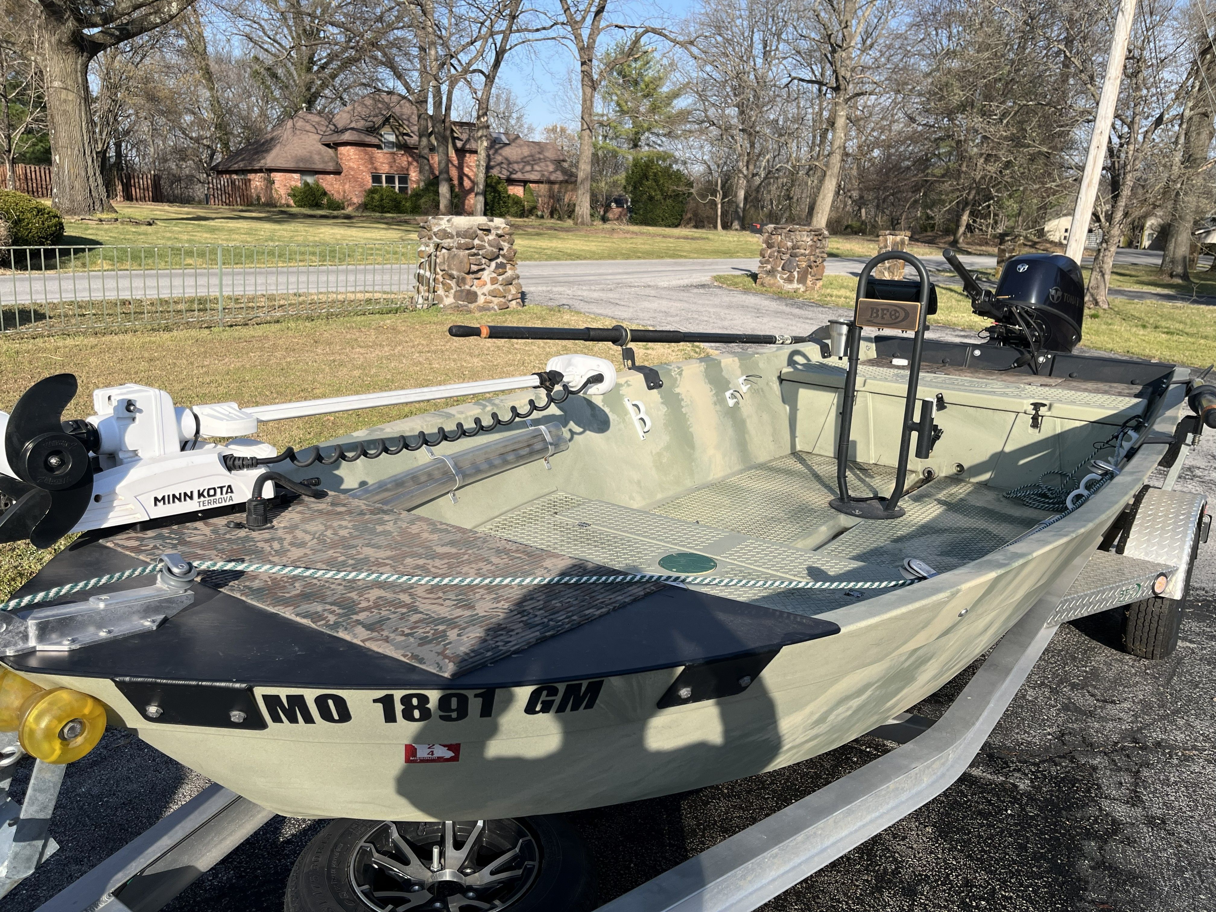 A 2020 Hog Island Boat Works SW 16 on a trailer, featuring a Minn Kota motor.