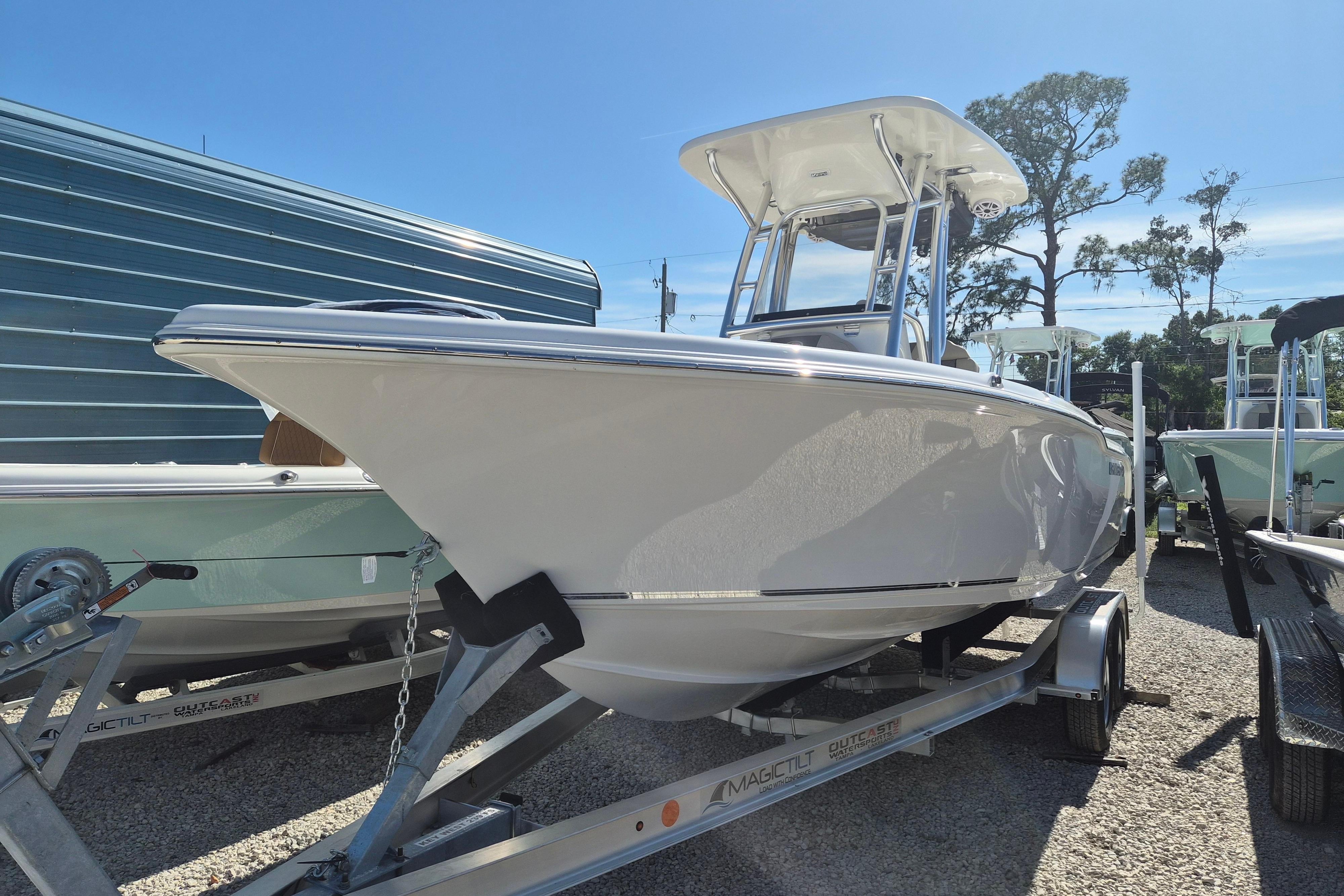 2026 Key West 239 FS boat on trailer under clear blue sky.