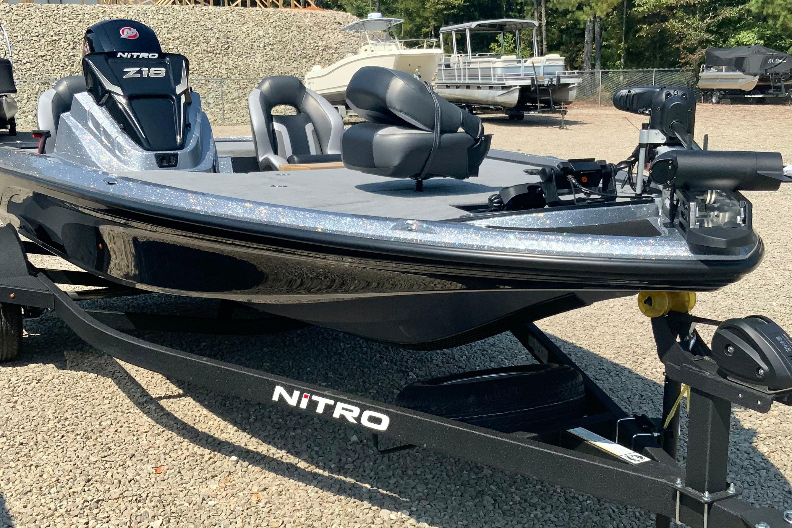 2026 Nitro Z18 Pro boat on trailer, parked on gravel lot.