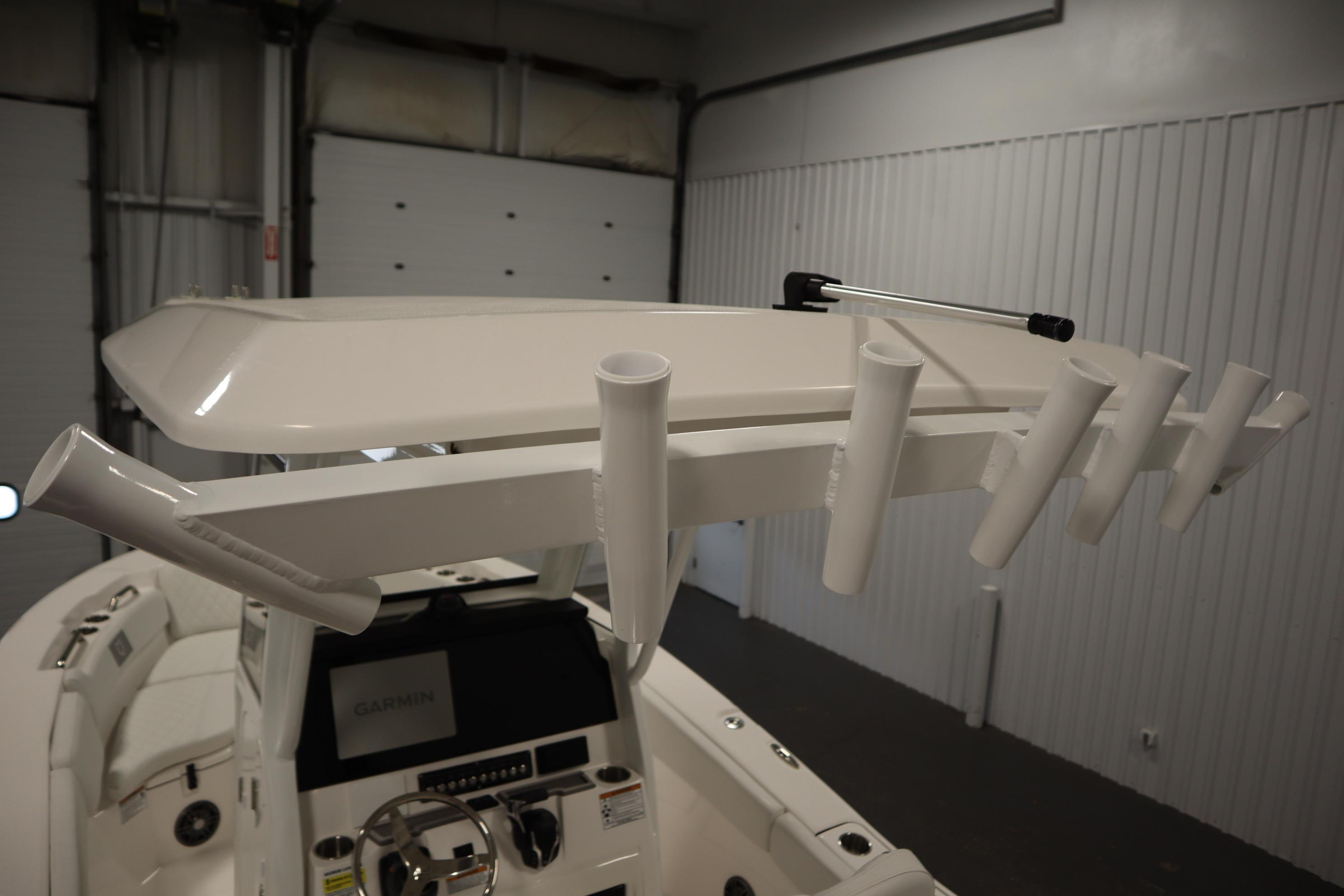 2026 Sea Fox 228 Commander boat interior with rod holders and Garmin navigation system.