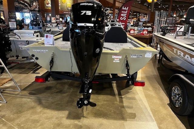 2026 Tracker Pro Team 175 boat with Mercury 75 engine displayed in showroom.