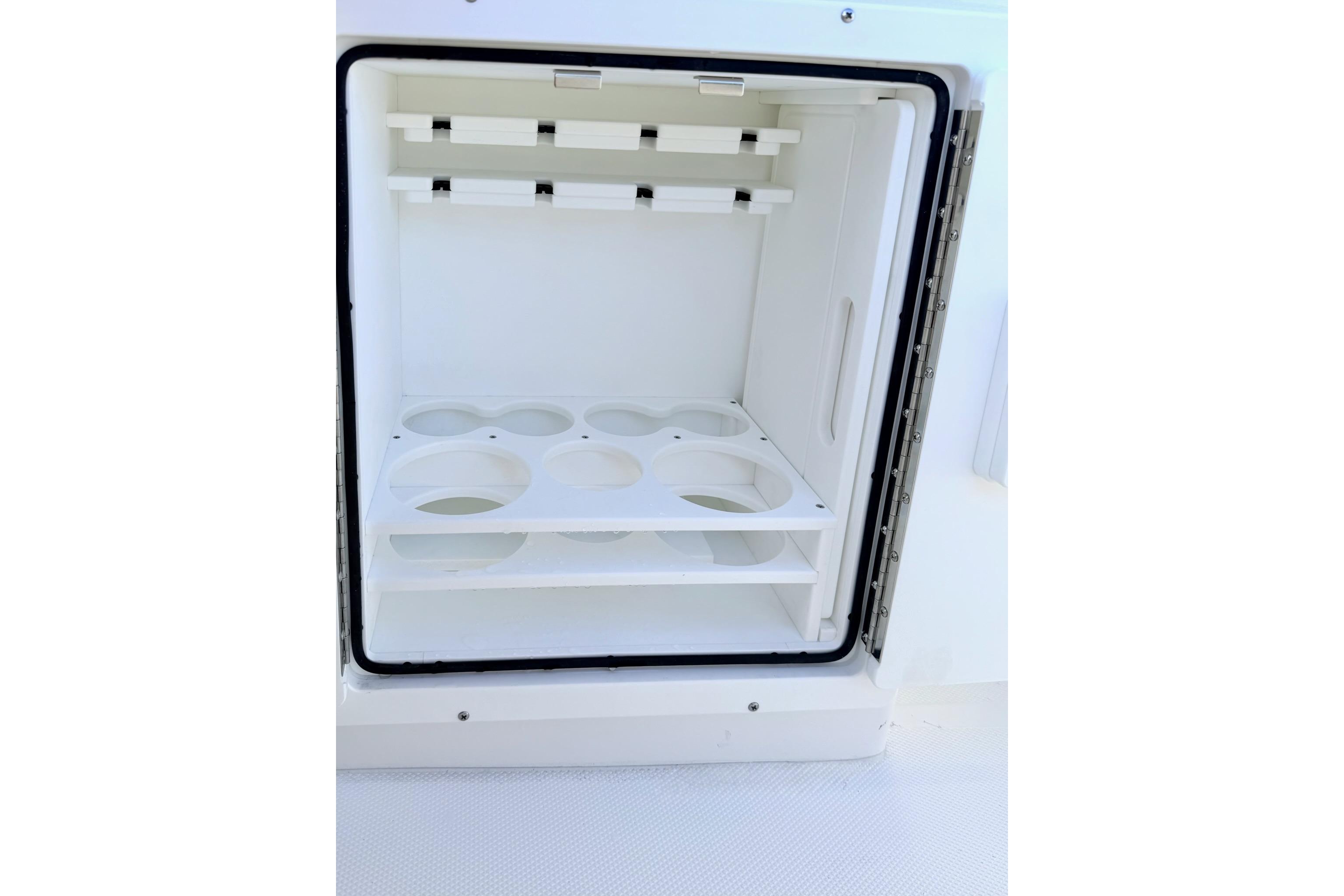 Open storage compartment on 2026 Sea Hunt Ultra 275 Coffin Box boat.