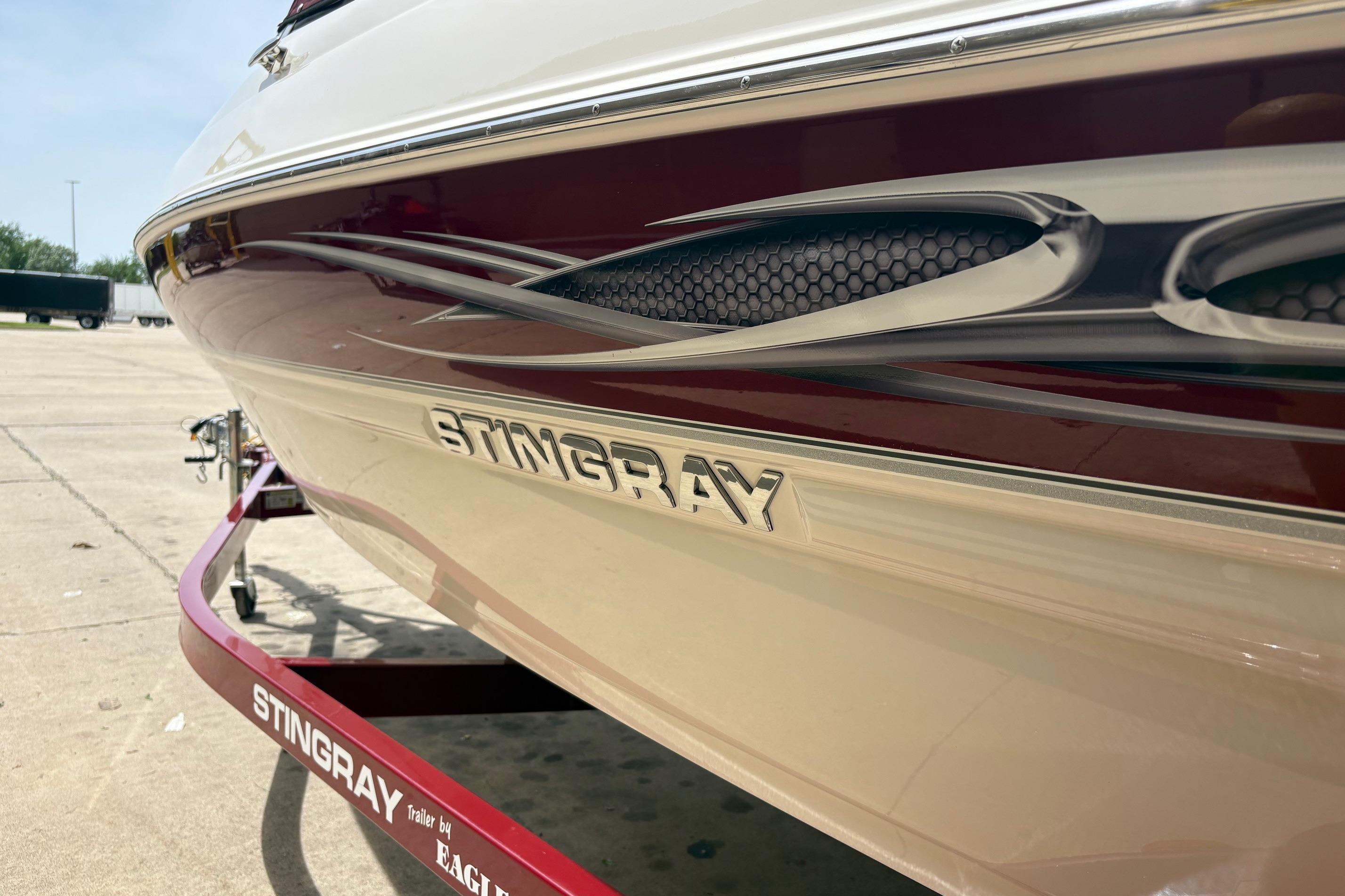 Close-up of a Stingray 198 LX boat hull on a trailer.