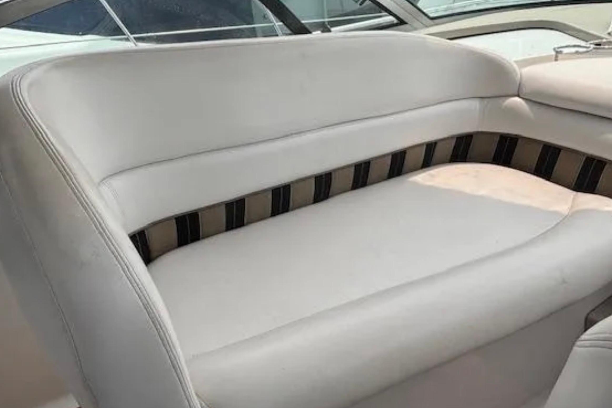White seating area on a 2007 Four Winns 378 Vista boat.