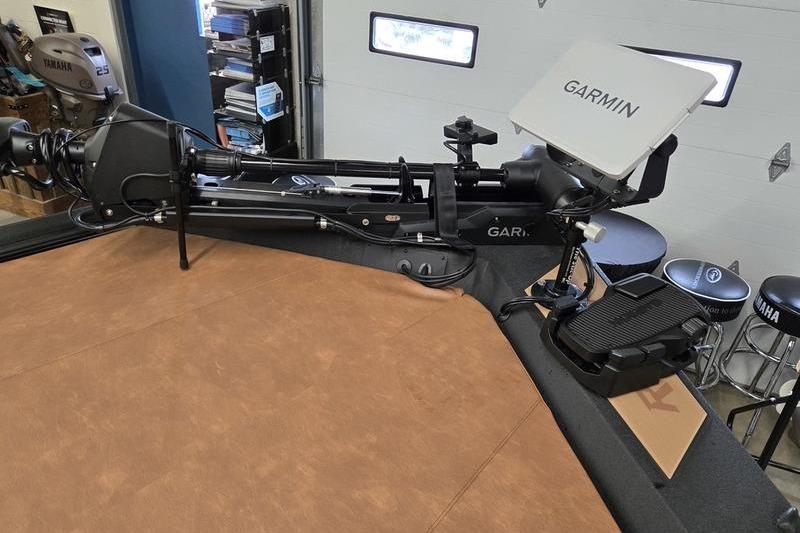 Avid 207 Recon 2026 boat with Garmin equipment in a garage setting.