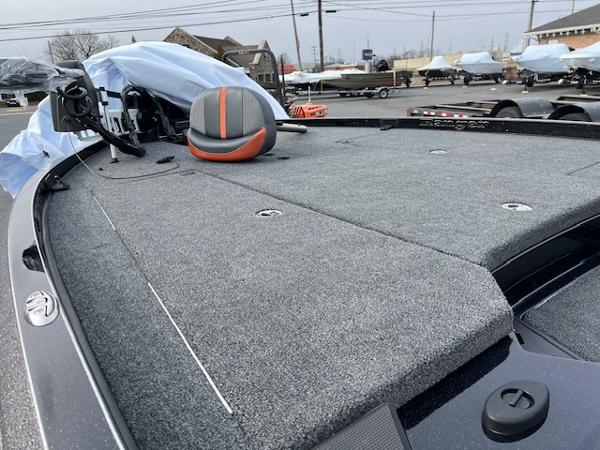 2025 Ranger Z520 boat deck with gray carpeting and equipment, parked outdoors.
