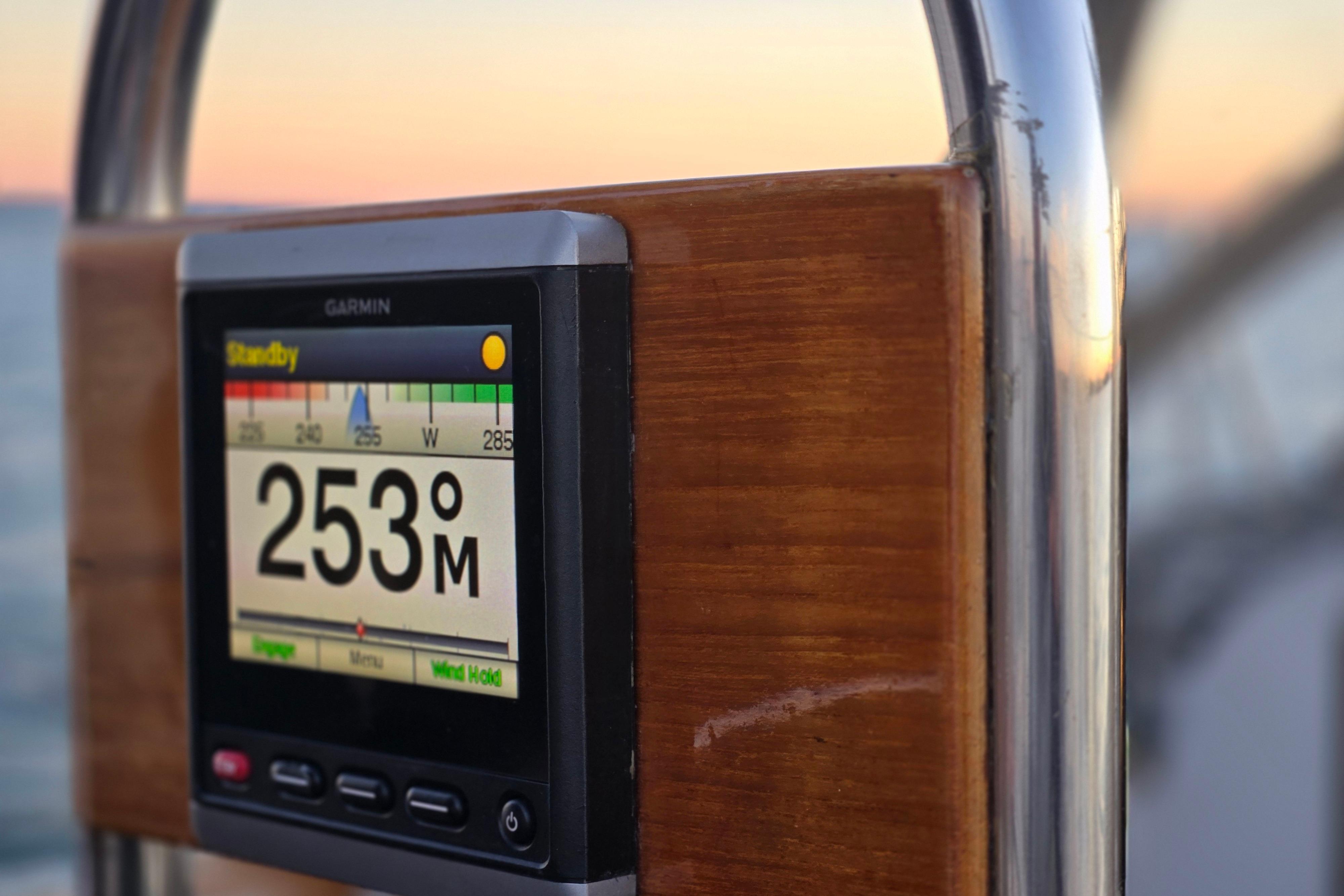 Garmin navigation display on 1970 Hinckley Bermuda 40 sailboat at sunset.