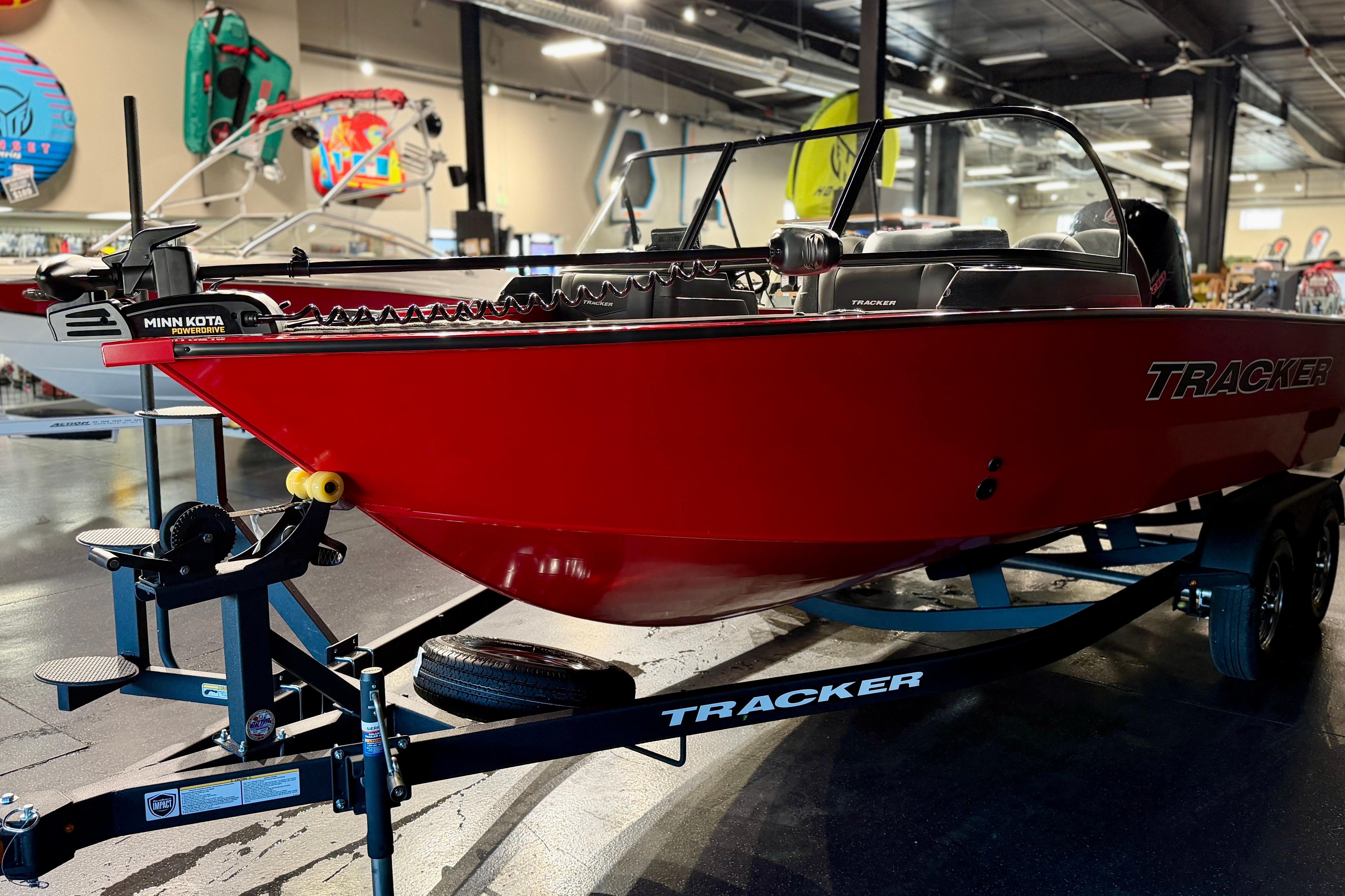 2026 Tracker Targa V-18 Combo boat in showroom, vibrant red with Minn Kota PowerDrive.