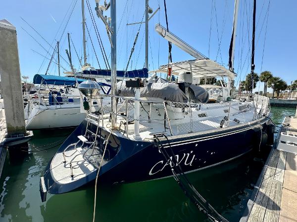 1989 Concordia 52 sailboat docked at marina, rear view.