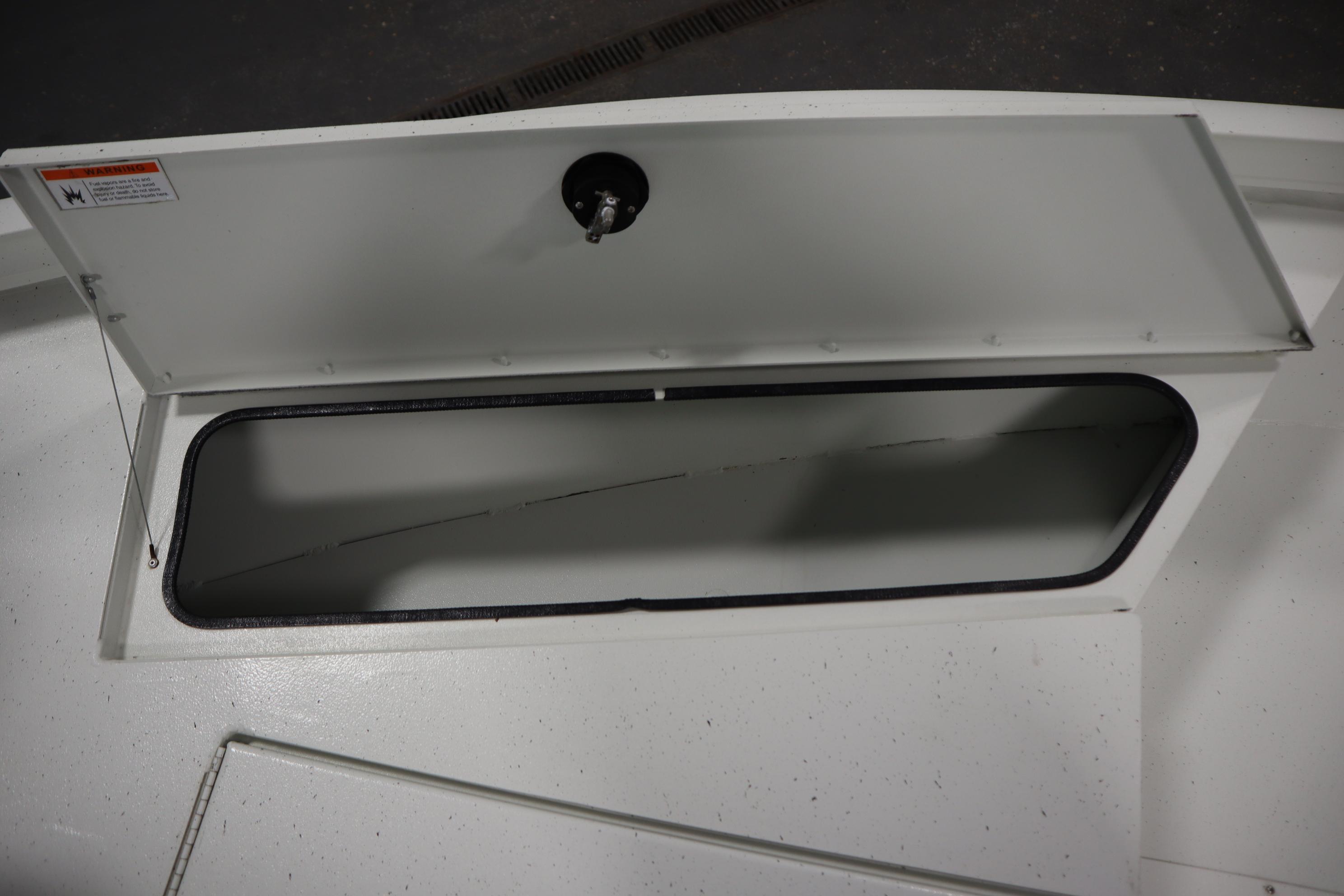 Open storage compartment on 2022 Crestliner 2200 CC boat.