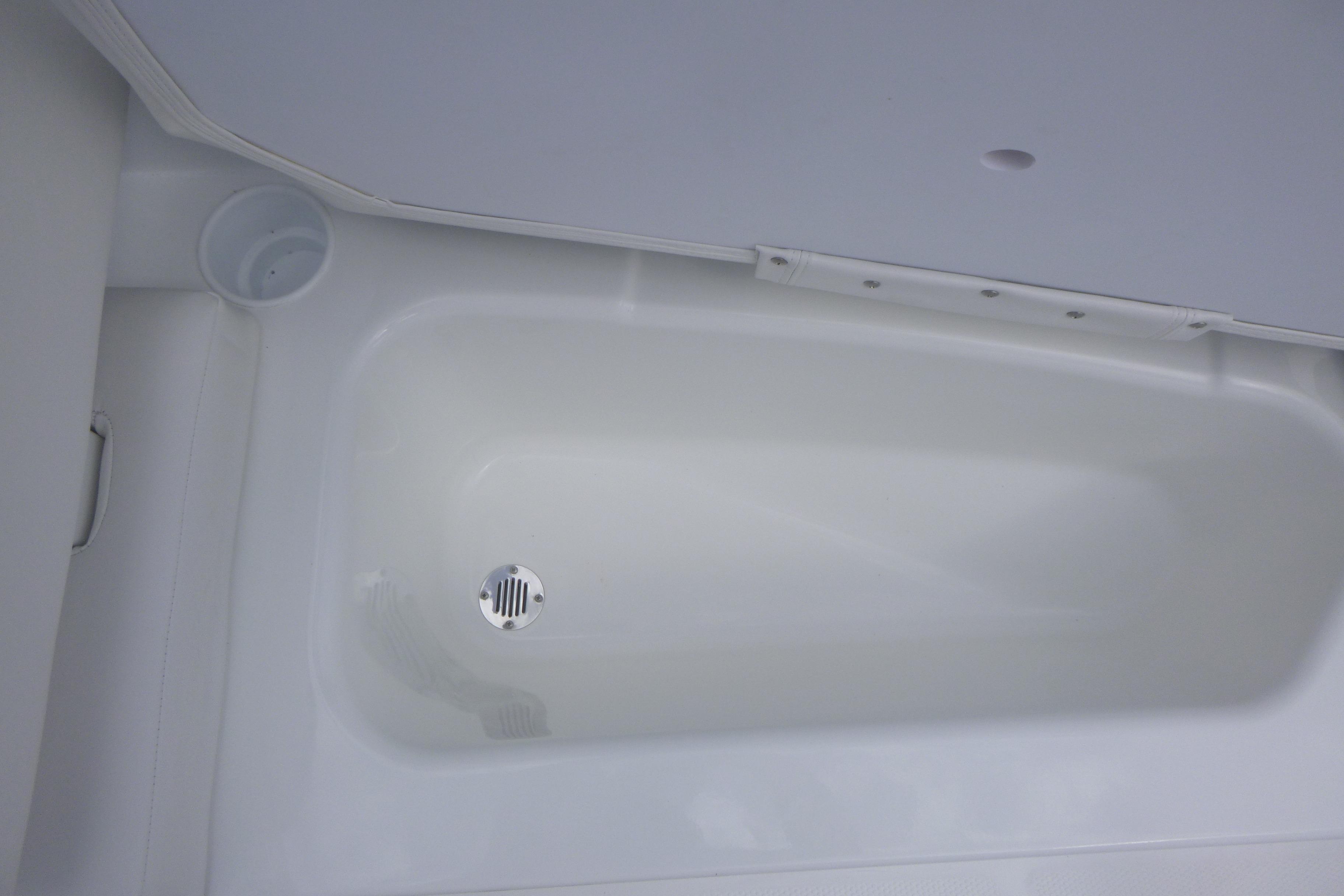 Interior view of 2026 Tahoe T16 boat's white storage compartment.
