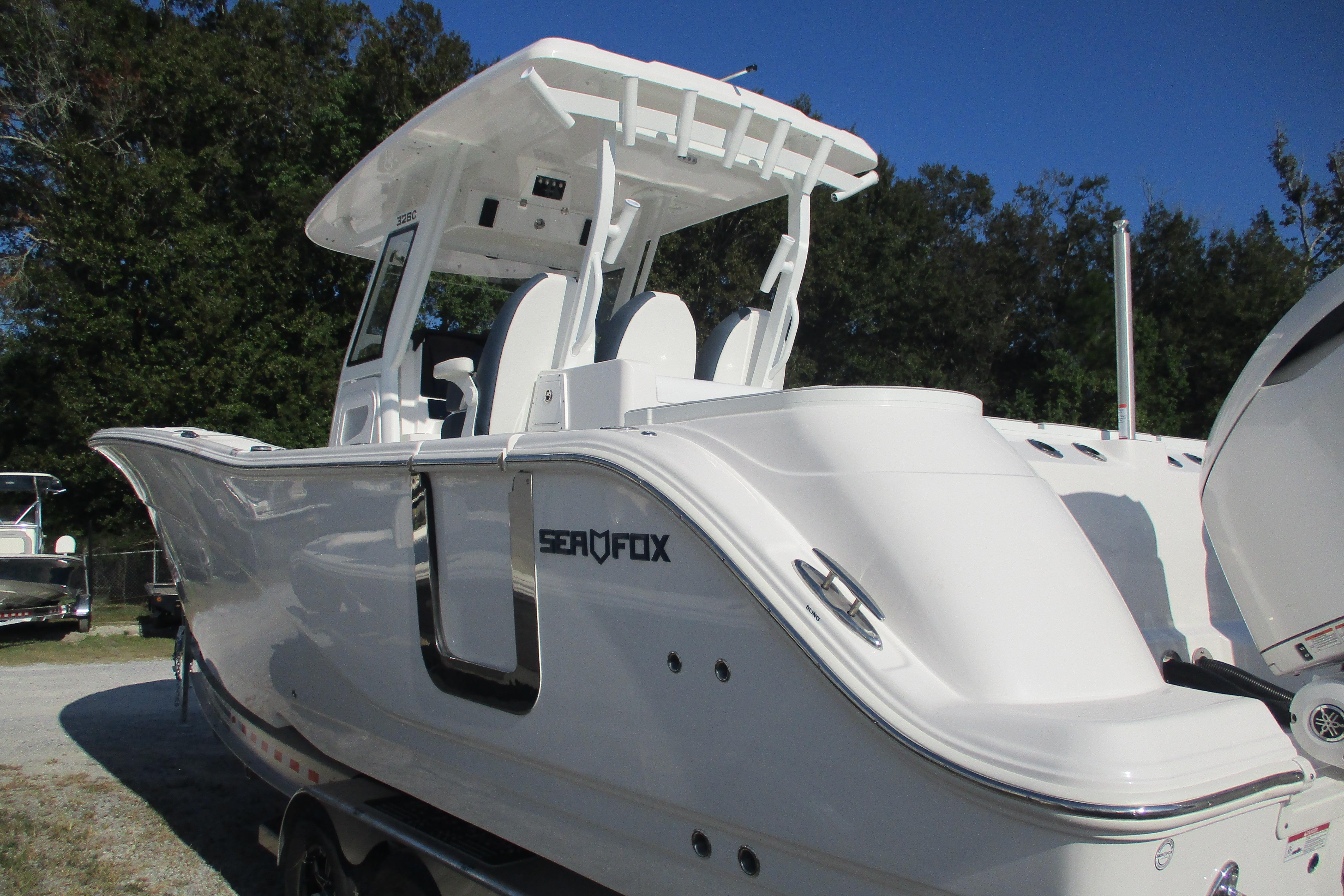 2026 Sea Fox 328 Commander boat, sleek white design, parked outdoors.