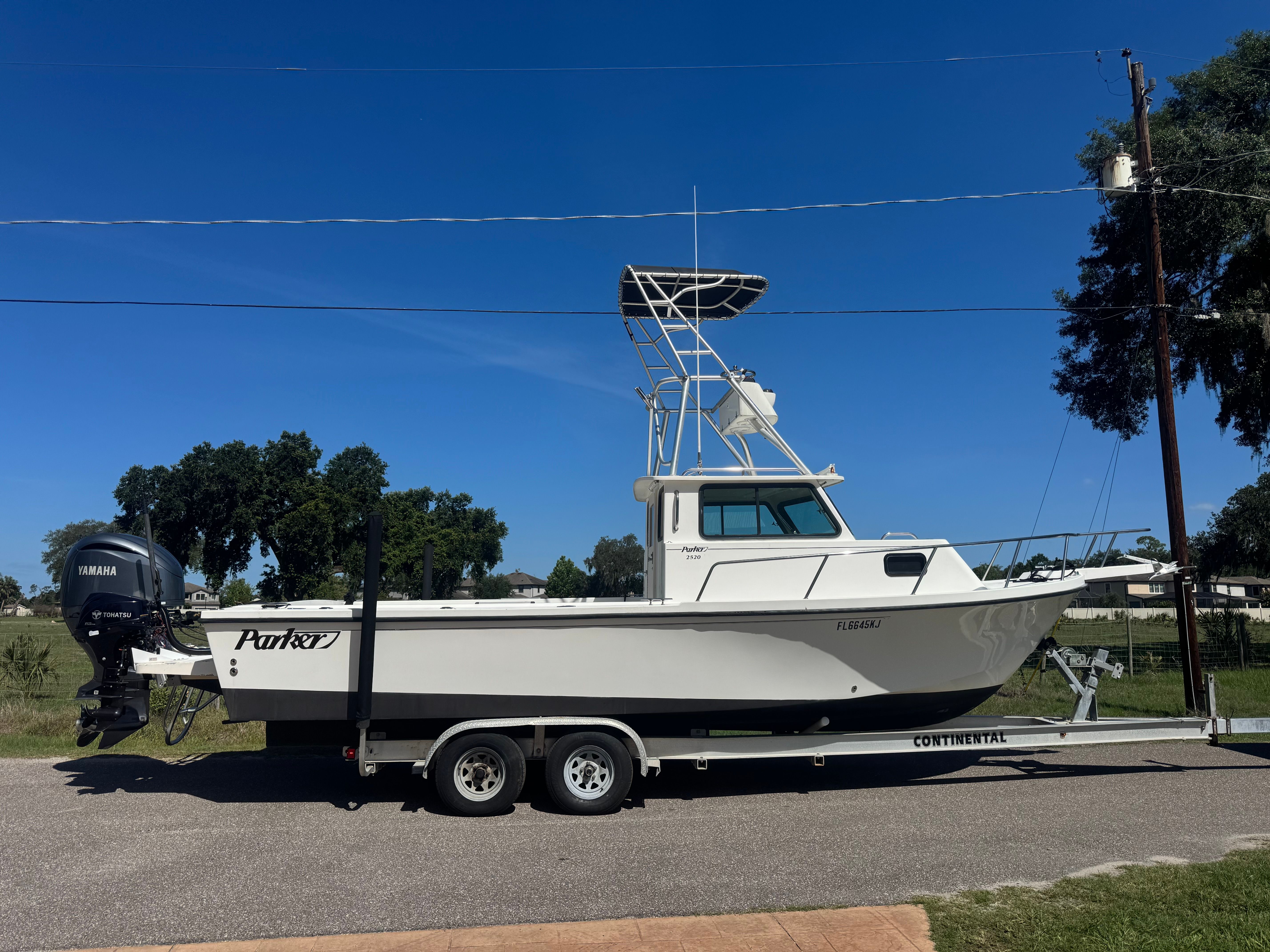 1997 Parker 2520 boat on trailer with Yamaha engine.