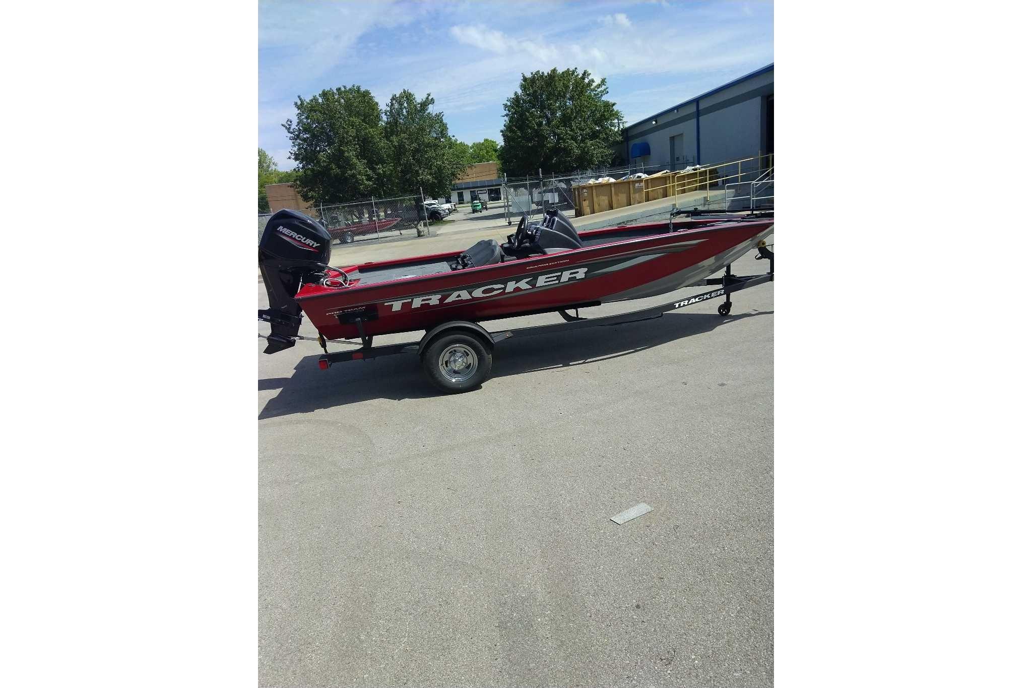 2026 Tracker Pro Team 175 Crappie Edition boat on trailer, parked outdoors.