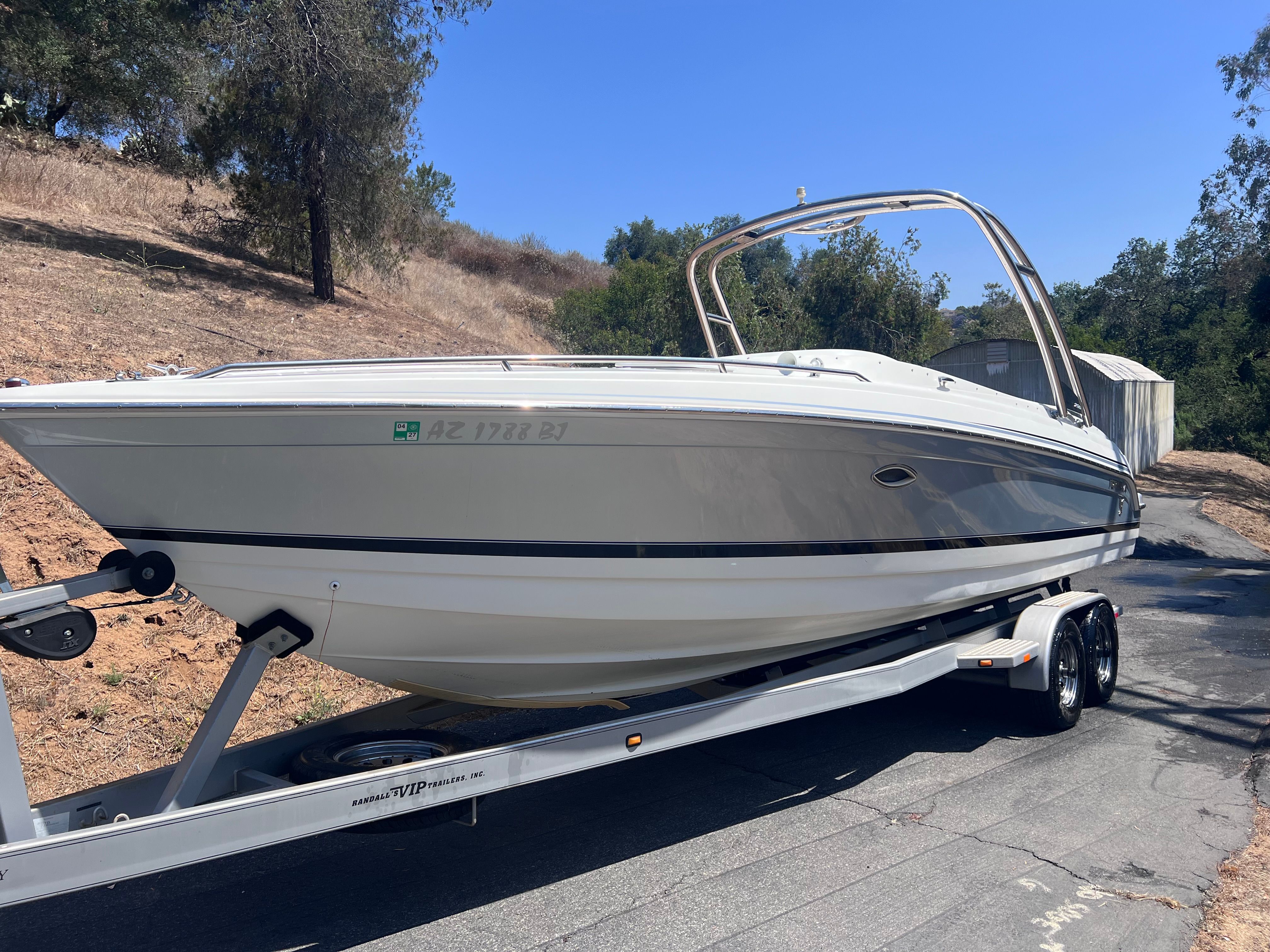 2006 Formula 260 Sun Sport boat on trailer, side view.