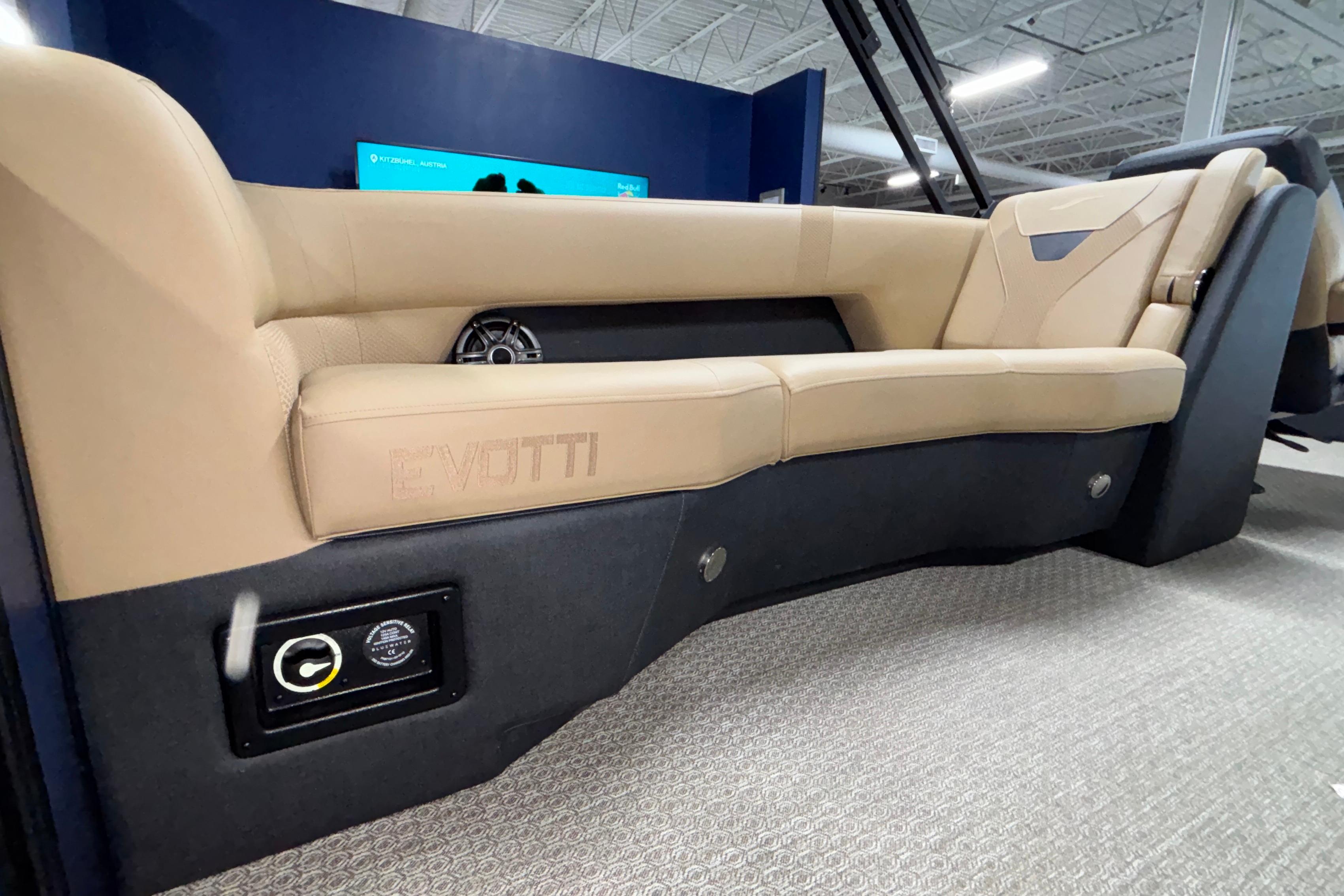 Luxurious interior of 2026 Evotti 525QL boat with beige seating and modern design.