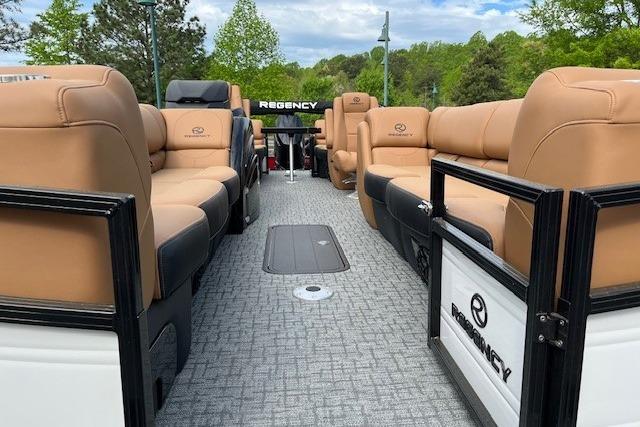 Luxurious 2026 Regency 250 DL pontoon boat with spacious seating and elegant design.