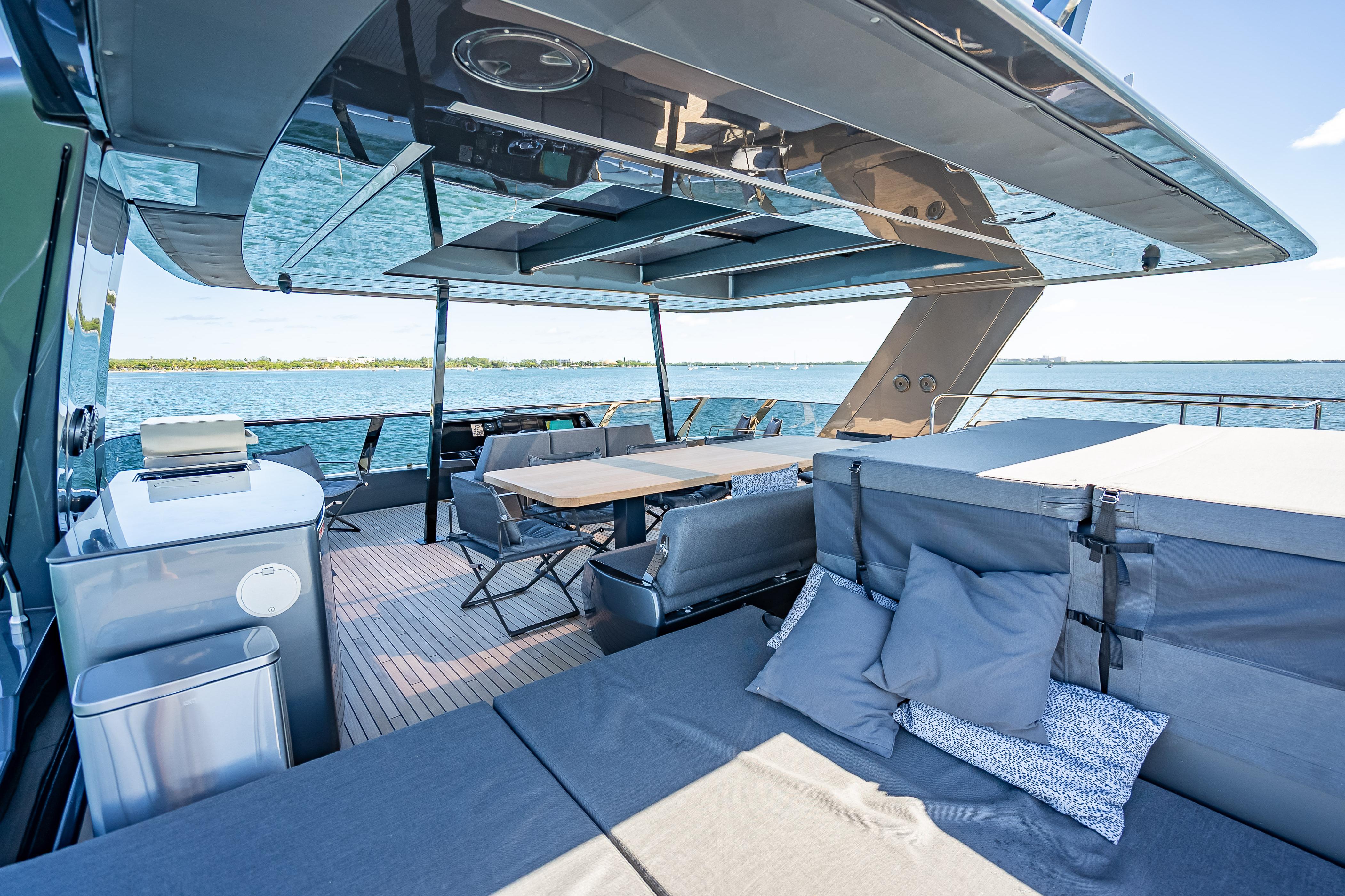 Luxurious Sunreef 60 Power yacht deck with seating, dining area, and ocean view, 2026 model.
