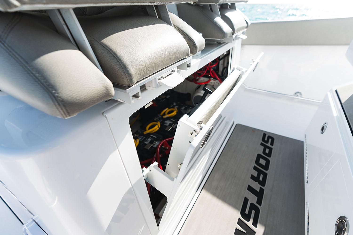 Manufacturer Provided Image: 2025 Sportsman Open 302 Center Console boat interior with storage compartment open.