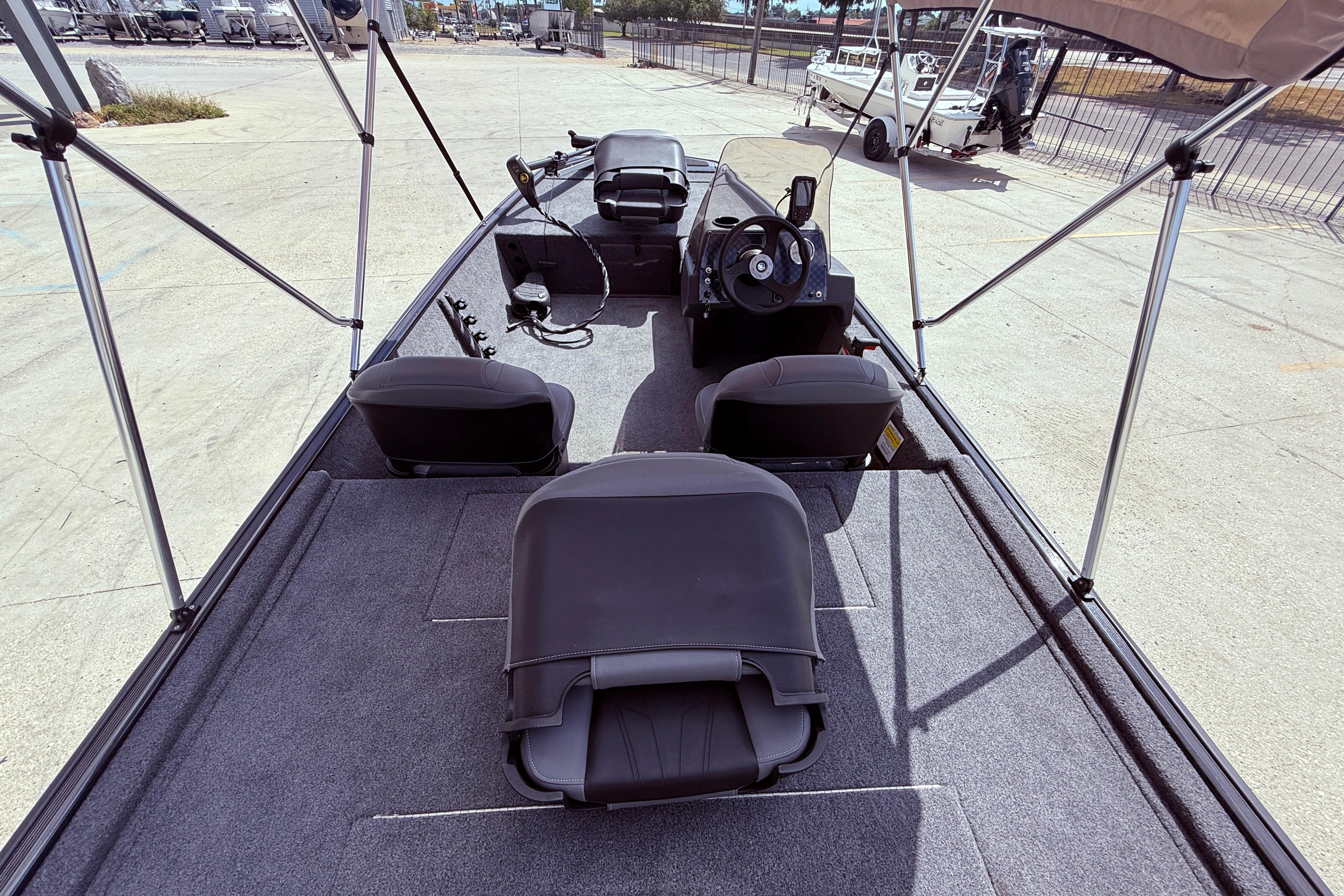 2025 Bass Tracker Classic XL boat interior with seating and steering console.