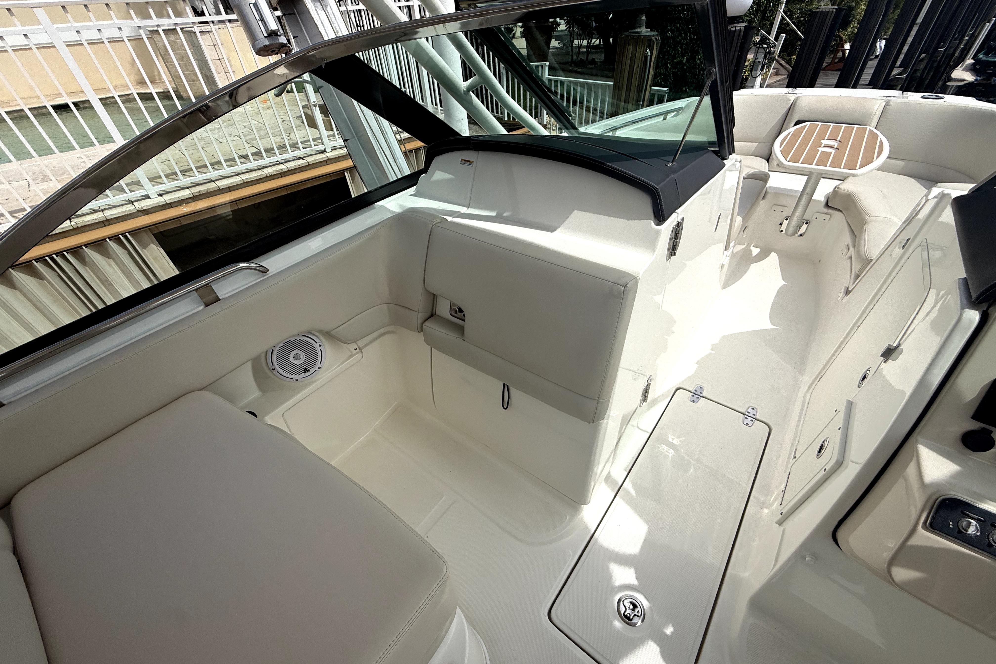 2018 Boston Whaler 230 Vantage boat interior with seating and table, showcasing luxury design.