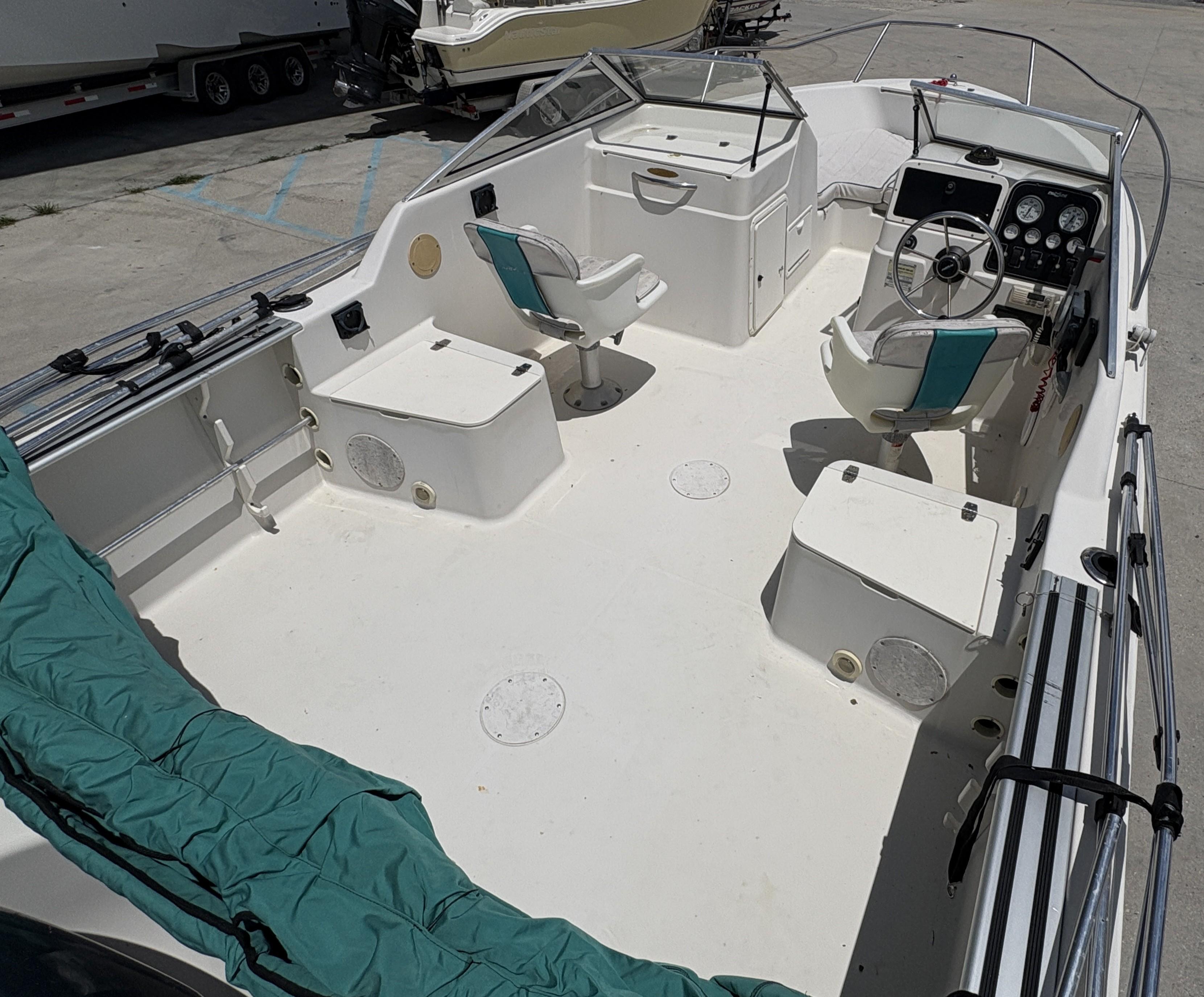1996 Pro-Line 202 boat interior with seating and steering console.