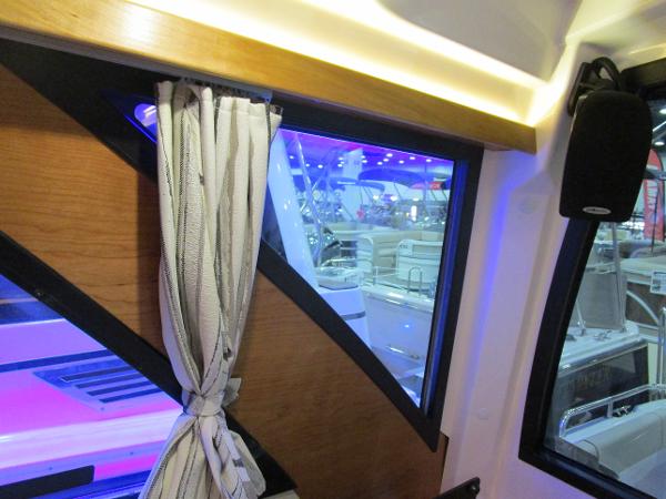 Interior view of 2025 Cutwater C-248 Coupe with window and curtain detail.