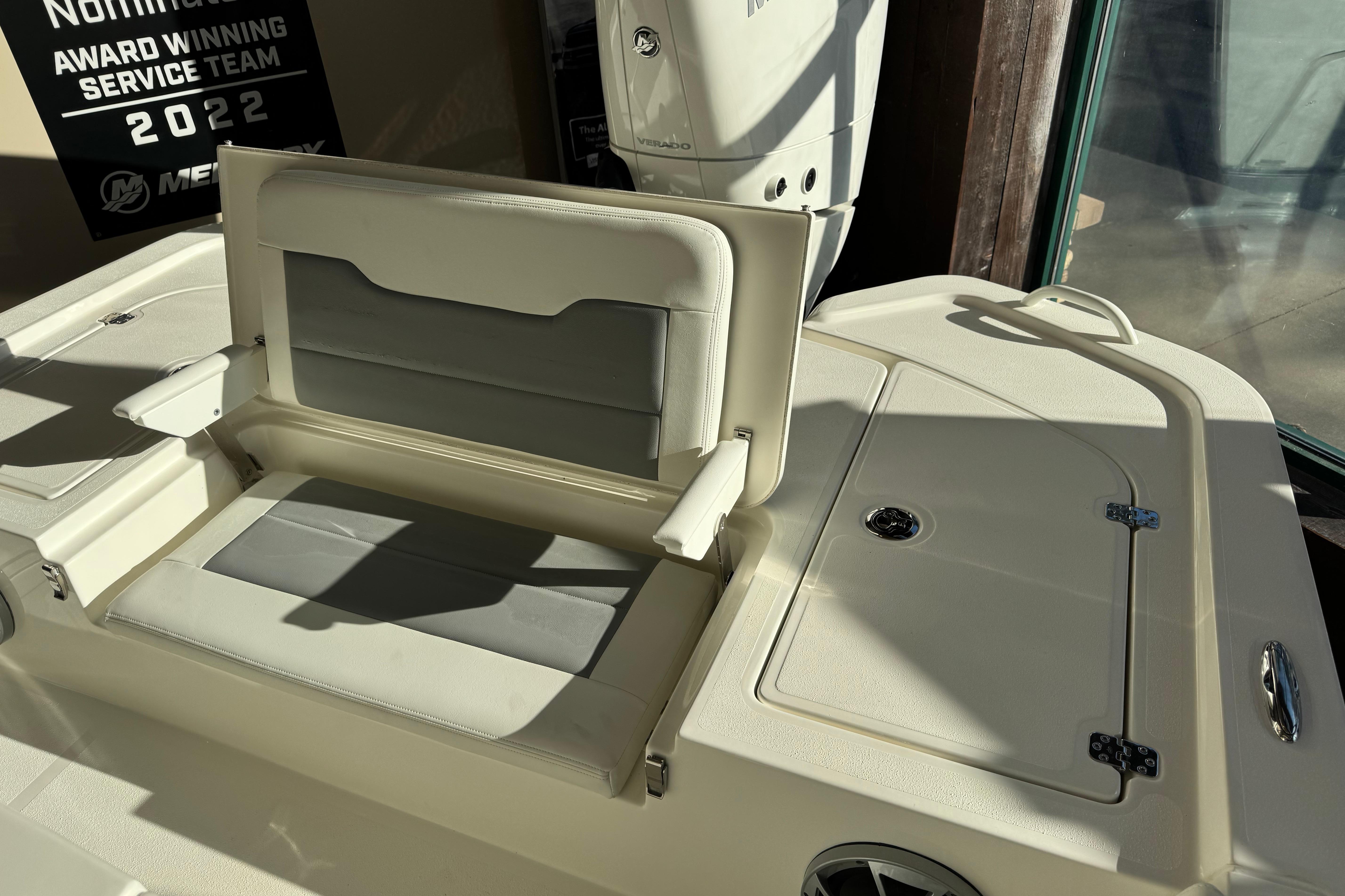 2026 Mako 24 APEX boat interior with seating and storage compartments.