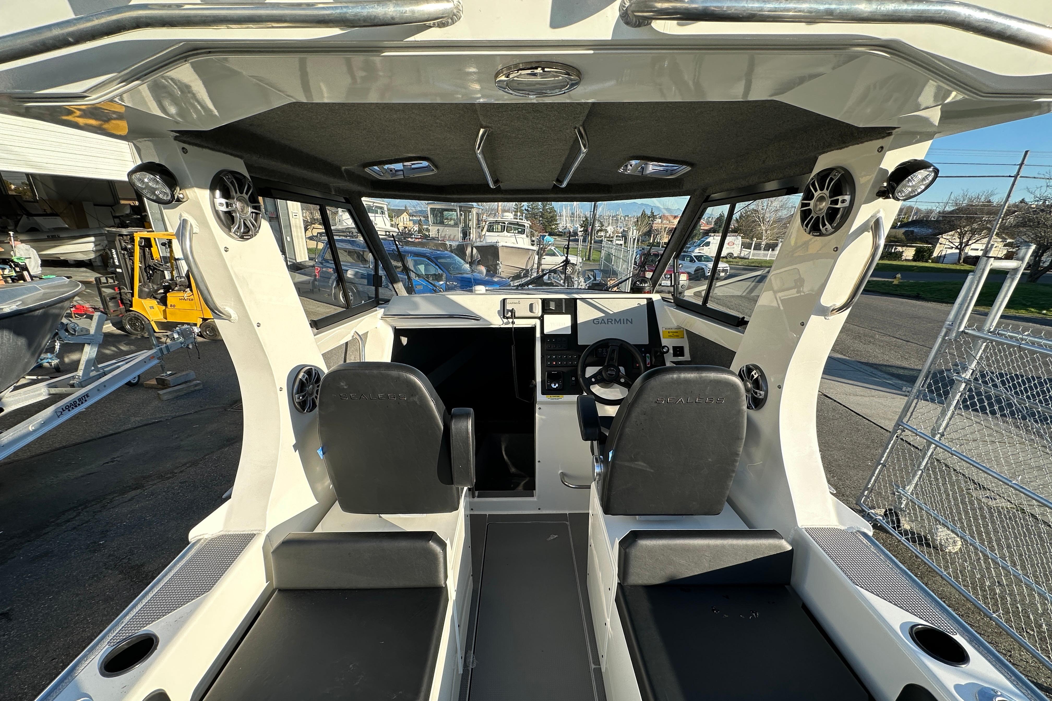 Interior view of 2026 Sealegs 8.5m Cabin boat with modern dashboard and seating.