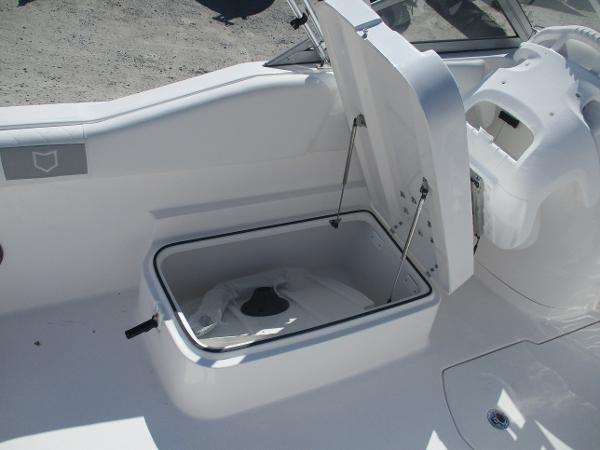 2025 Sea Fox 228 Traveler boat storage compartment open, showcasing interior space.