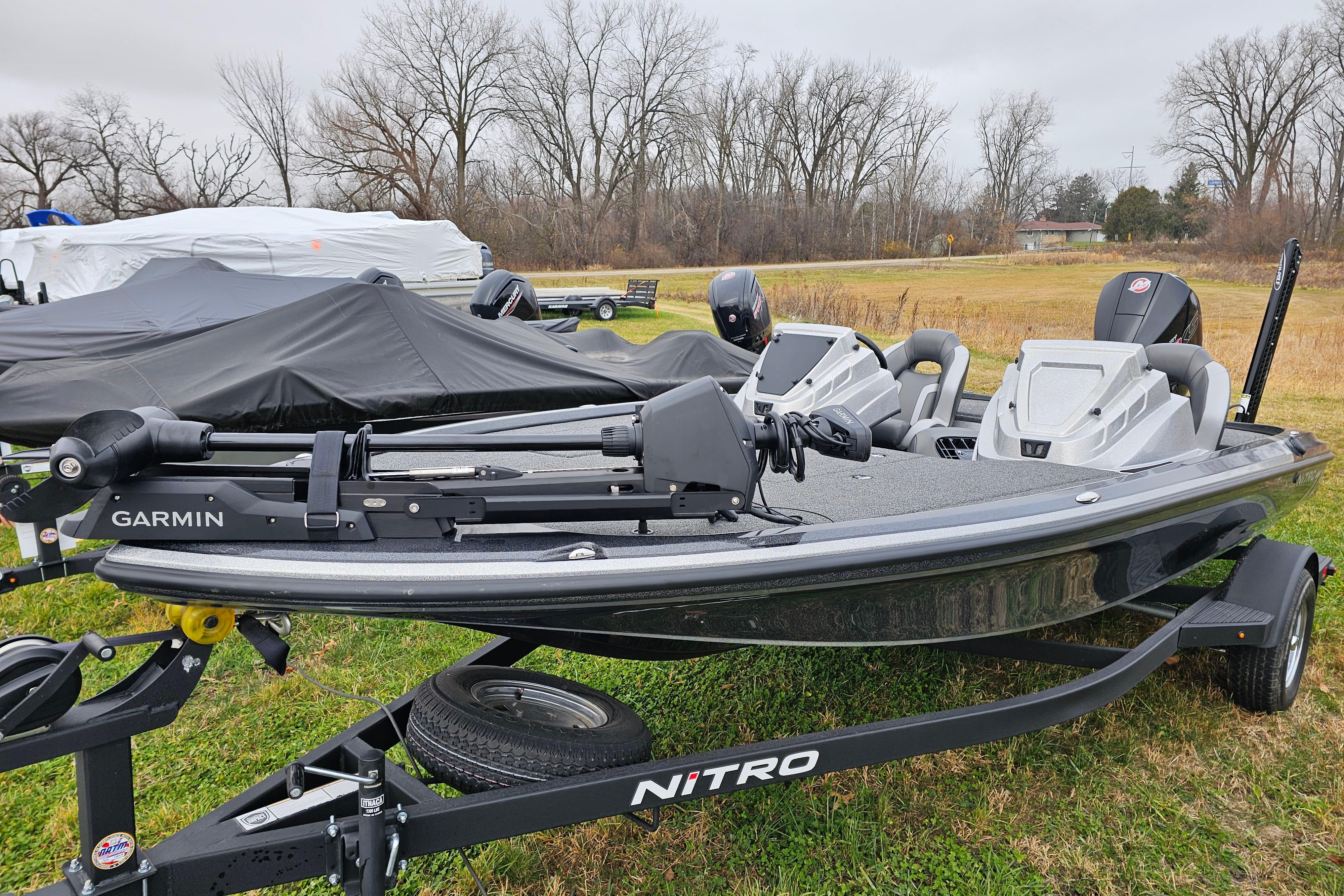 2025 Nitro Z18 Pro fishing boat with Garmin equipment on grassy field.
