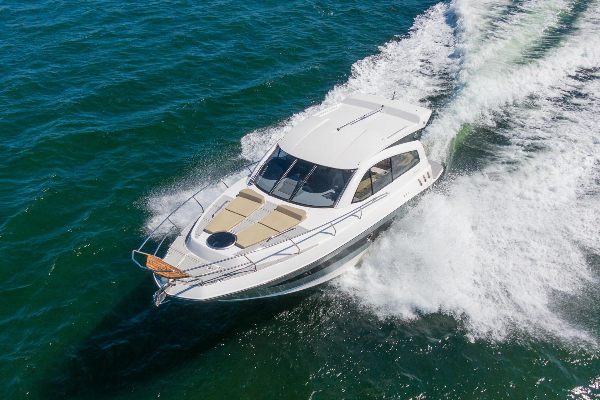2026 Hanover 375 yacht cruising on open water, showcasing sleek design and performance.