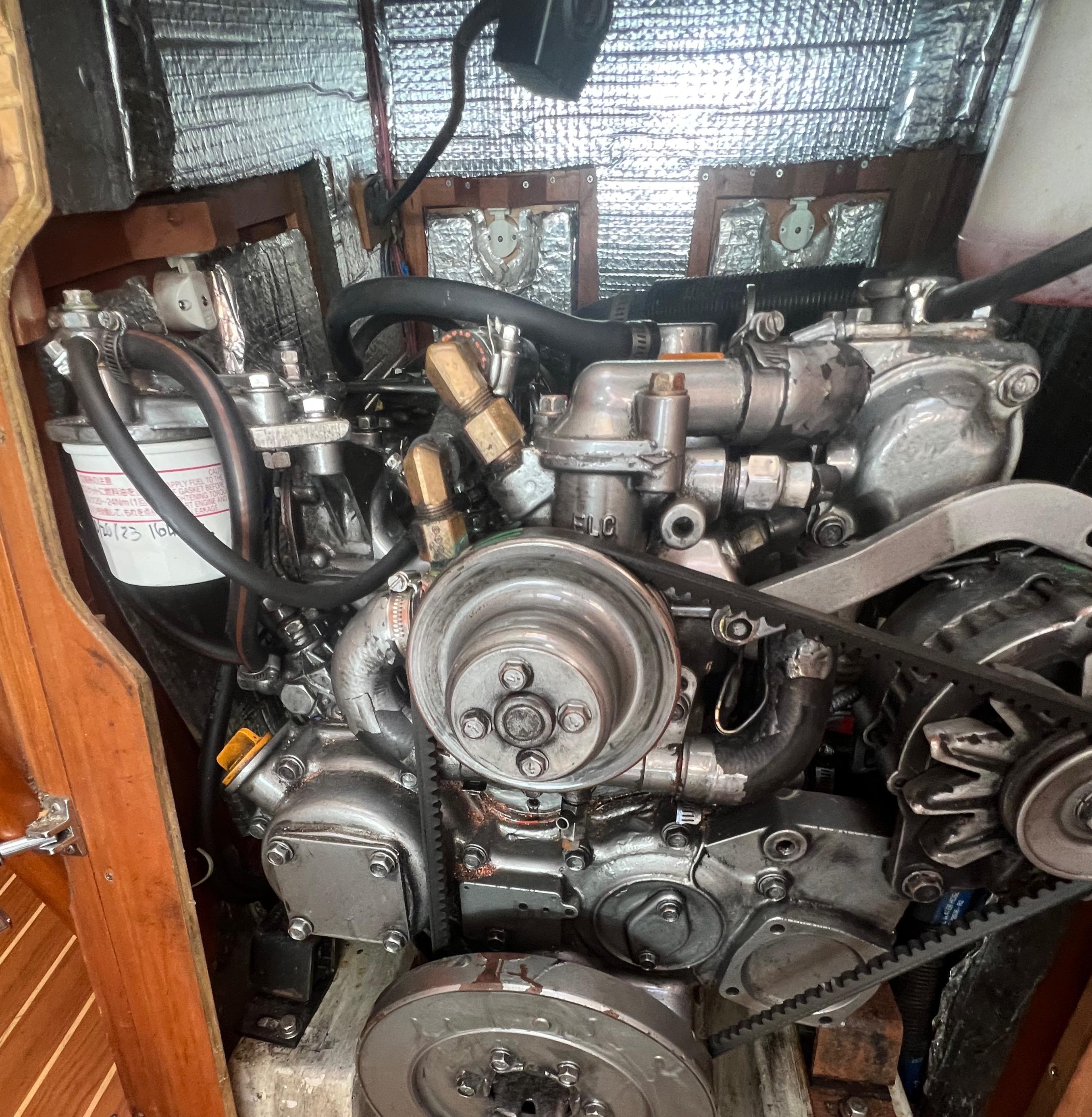 Engine of a 2003 Tartan 4100 sailboat, showcasing mechanical components and belts.