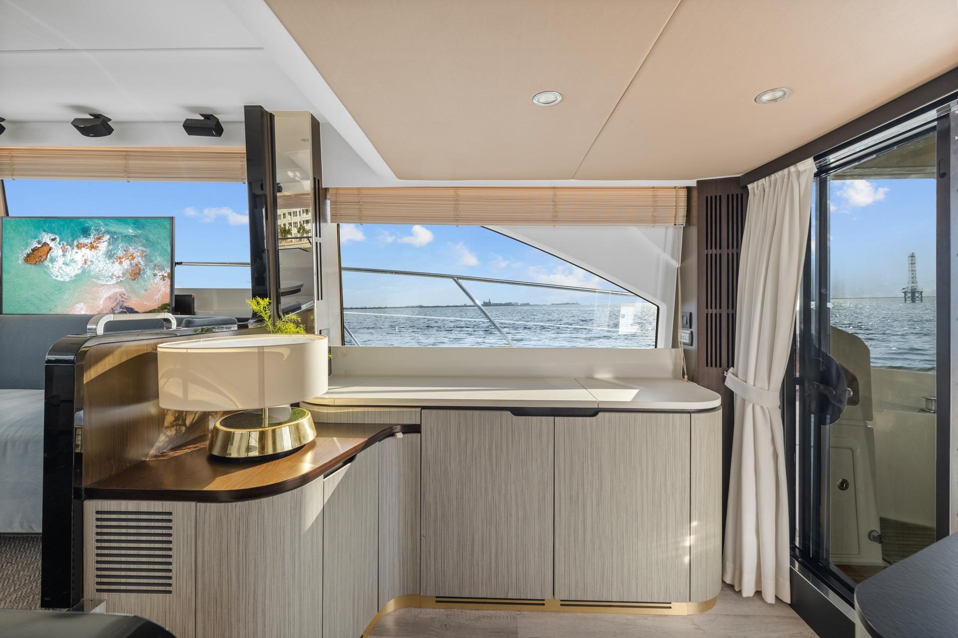 Luxurious interior of 2019 Azimut 55 yacht with ocean view and modern decor.