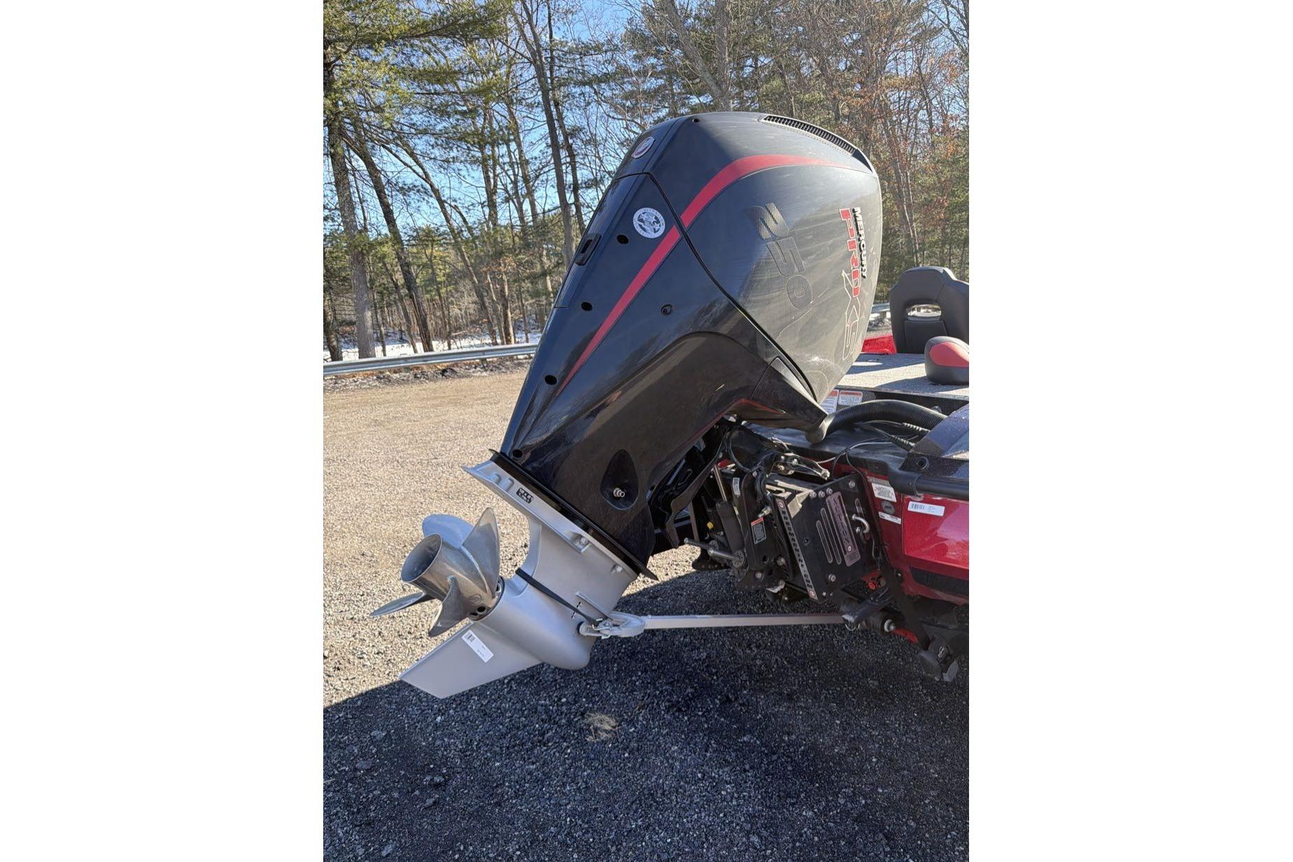 2026 Nitro Z21 XL Pro boat engine with propeller, parked outdoors.