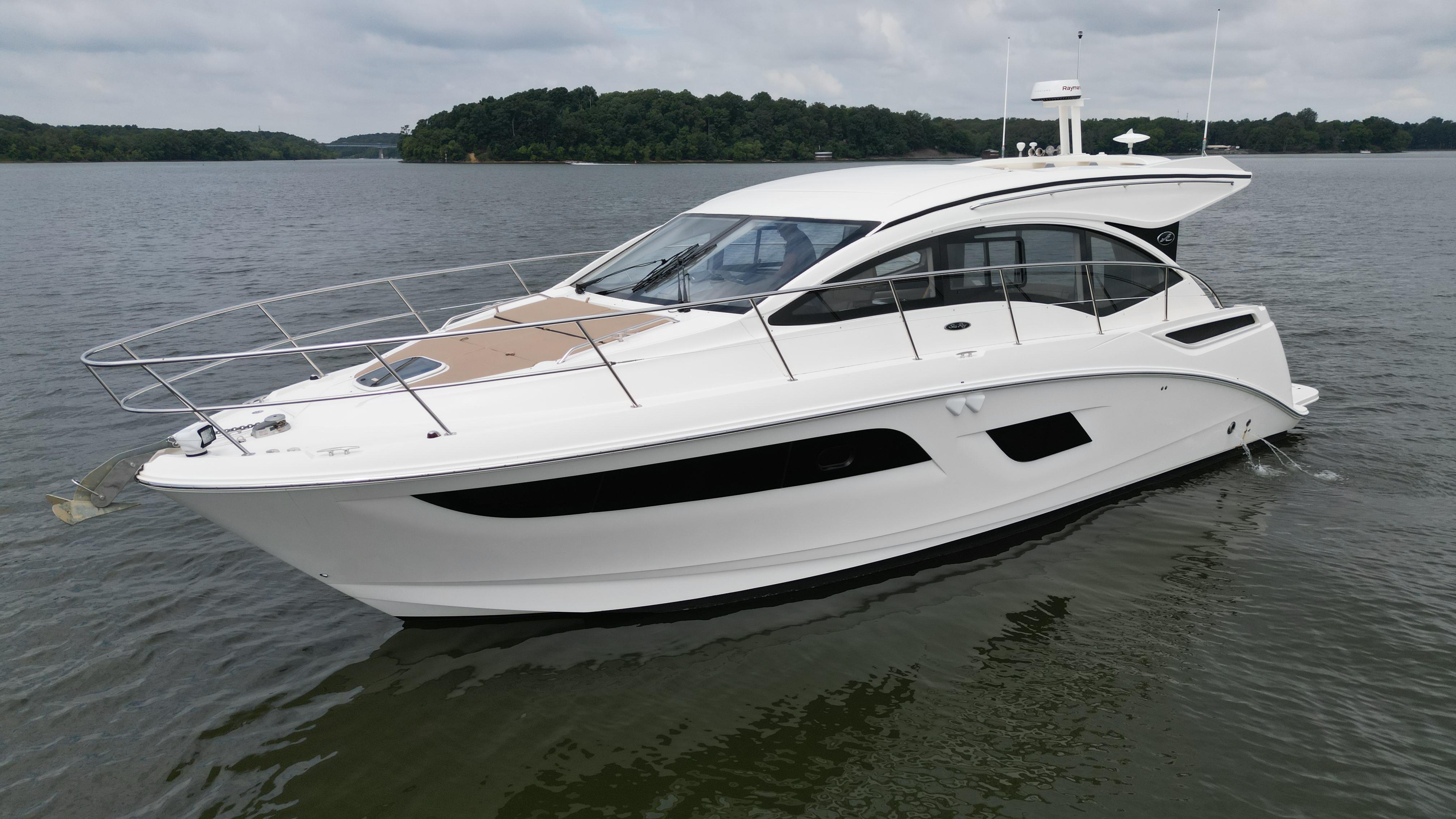 2017 Sea Ray Sundancer 400 yacht on calm water, showcasing sleek design and modern features.