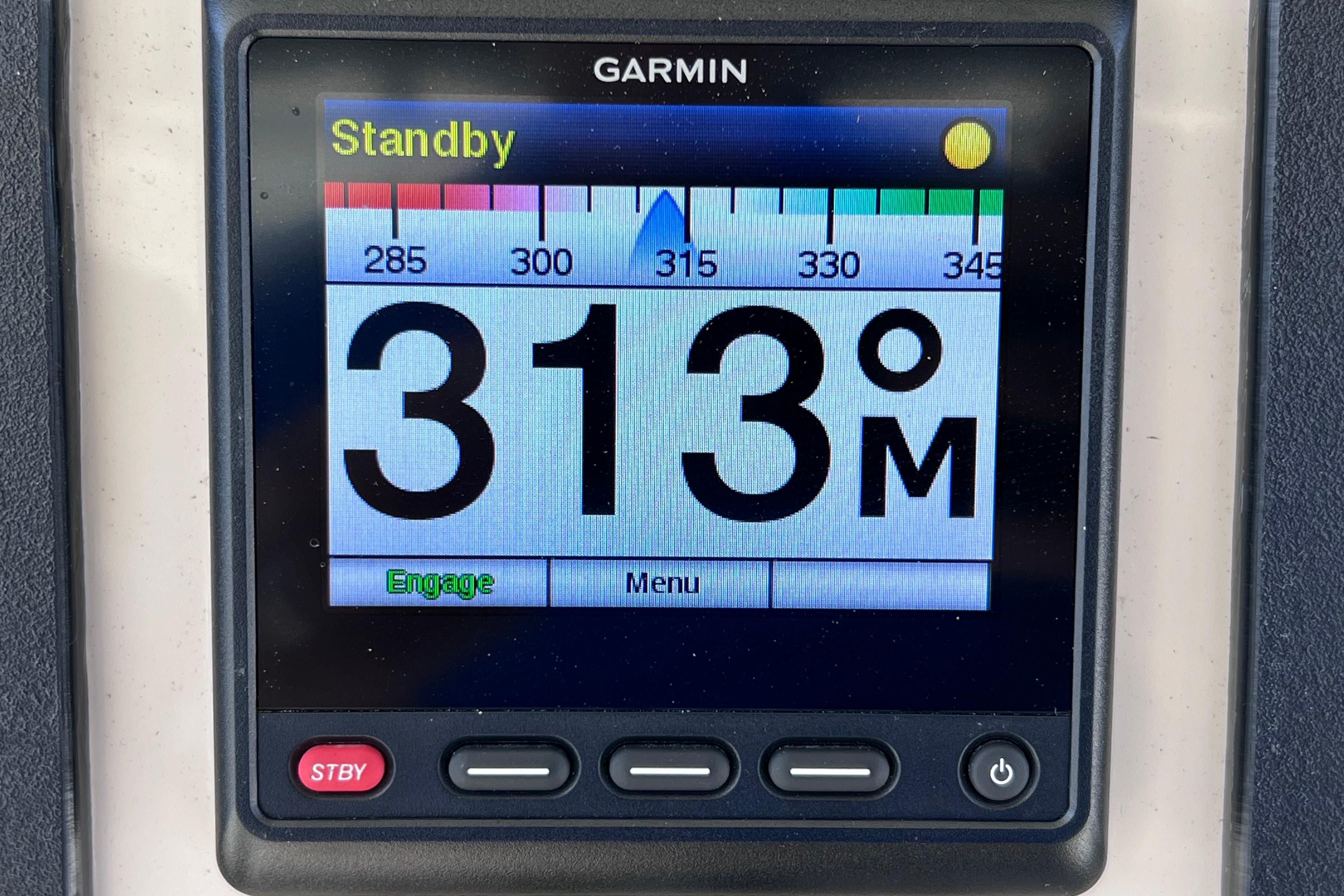 Garmin display on 2021 Boston Whaler 330 Outrage showing 313° heading in standby mode.
