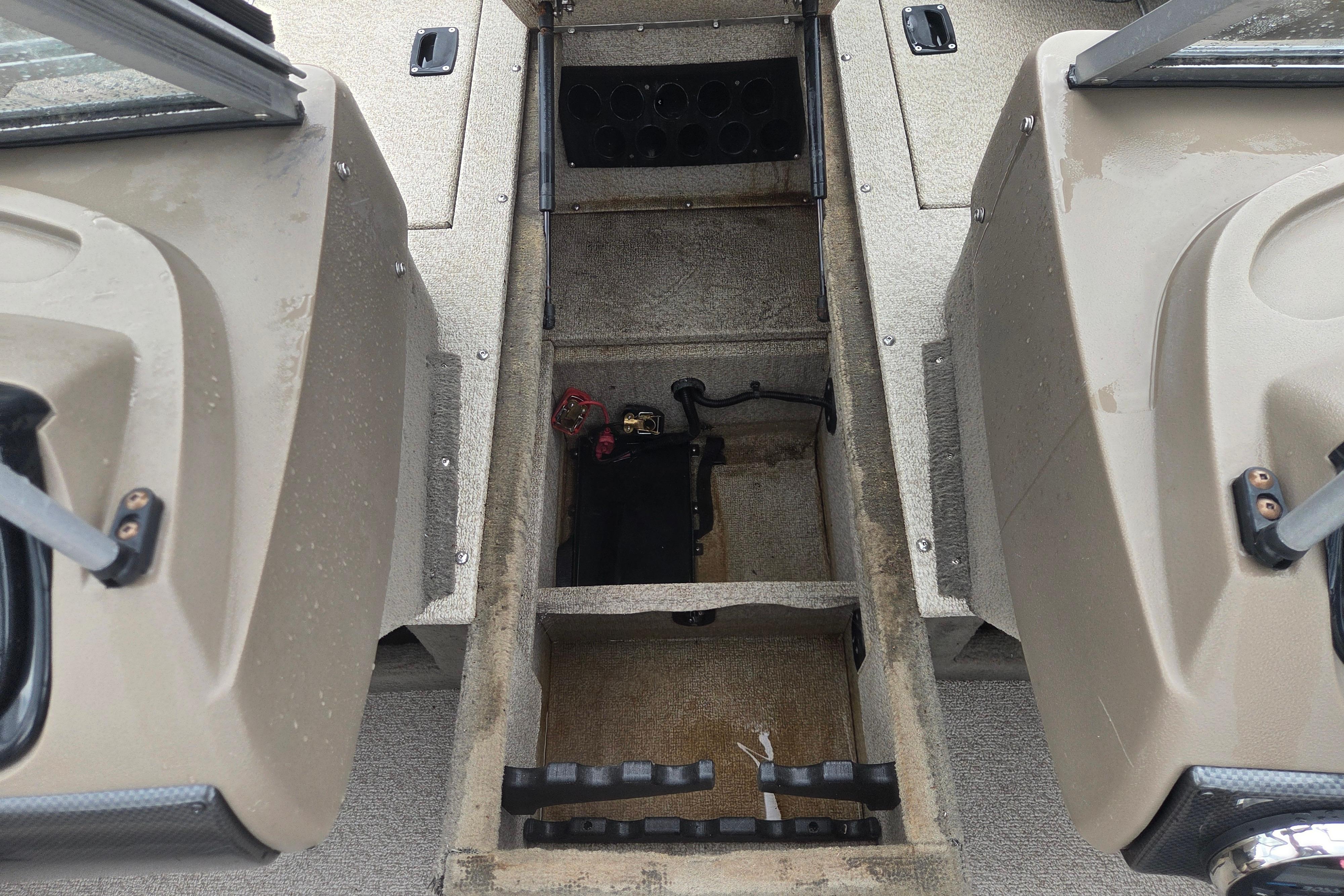 2016 Crestliner 1650 Fish Hawk SC interior storage compartments and console view.