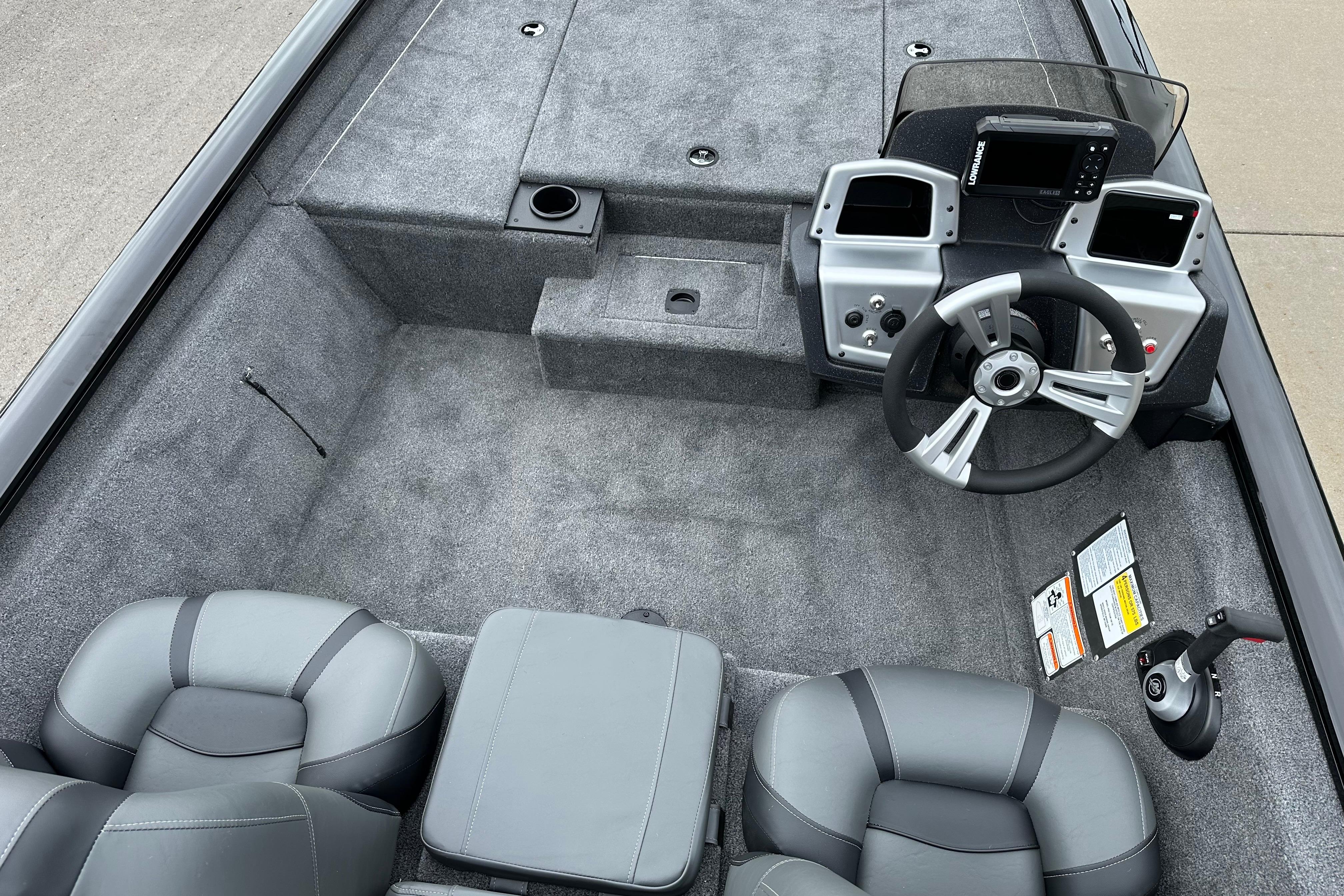 2026 Tracker Pro Team 190 boat interior with steering console and seating.