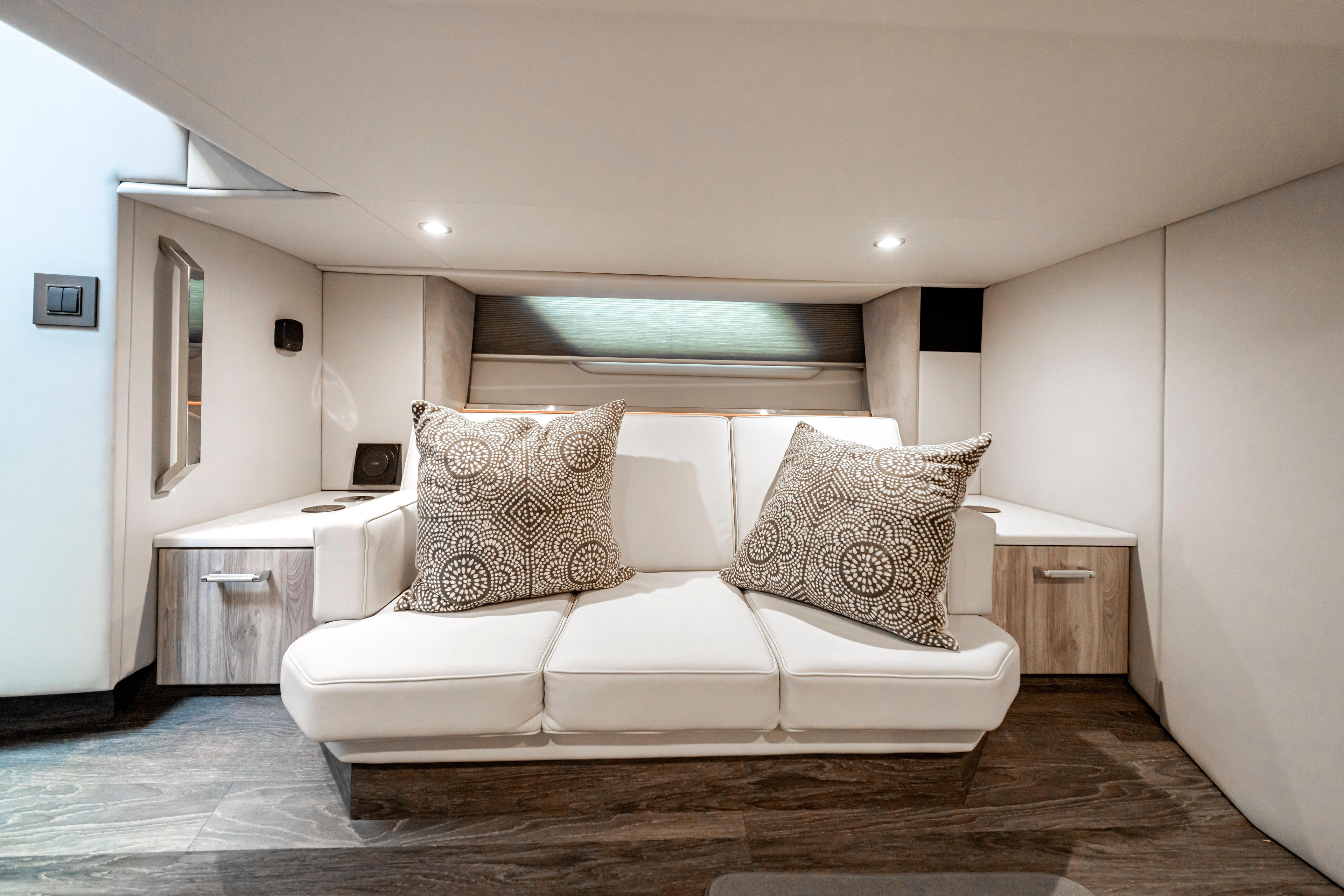 Luxurious interior of 2022 Formula 500 Super Sport Crossover with elegant seating and cushions.