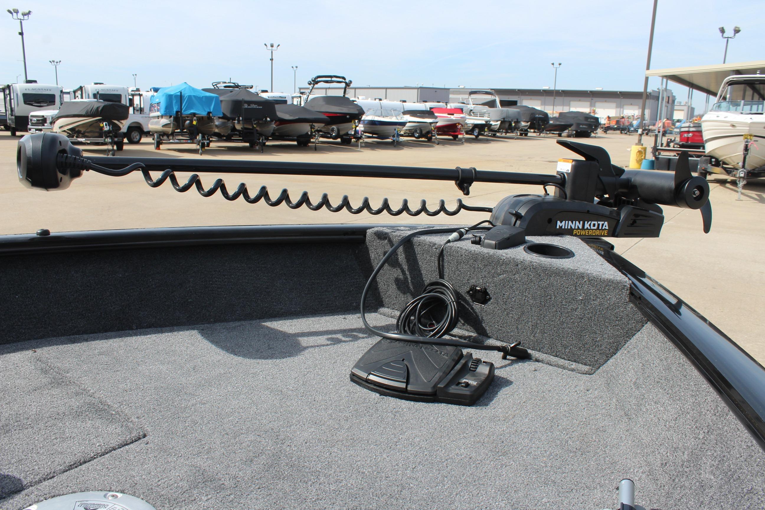 2026 Tracker Pro Guide V-16 WT boat with Minn Kota trolling motor in a marina.