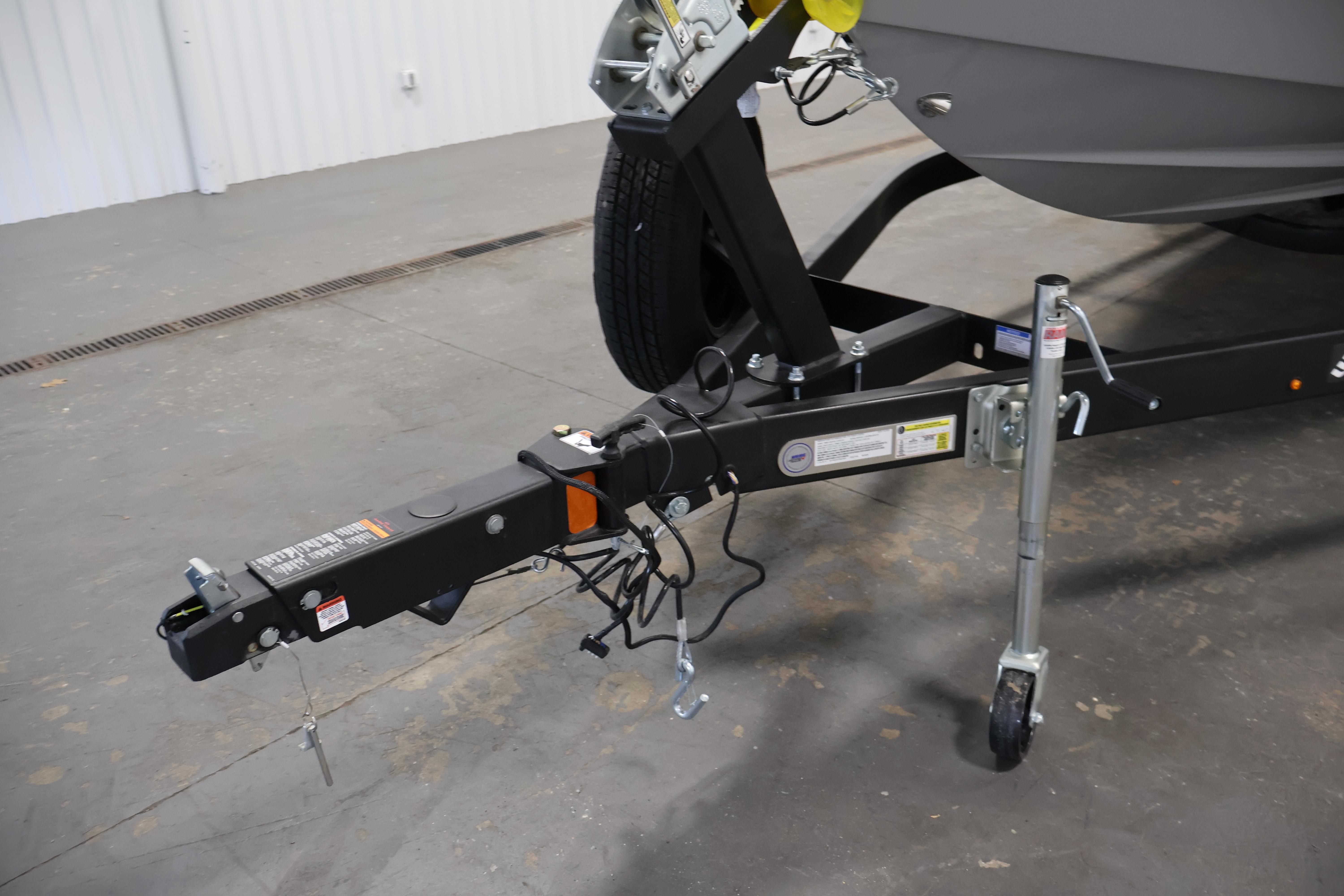 Trailer hitch of 2026 Four Winns H4 Freedom boat in a garage setting.