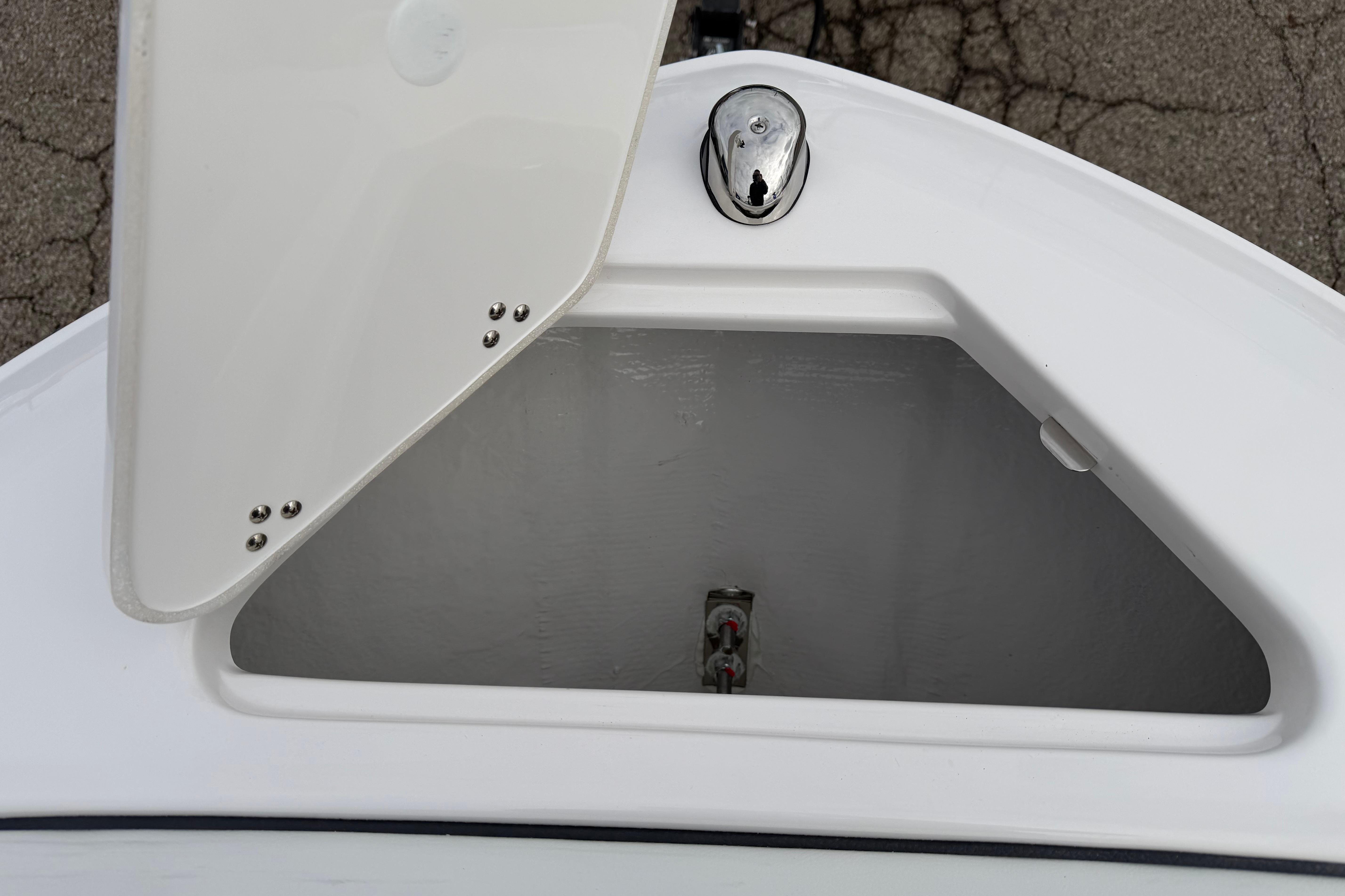 Open storage compartment on 2026 Regal LS2 Surf boat.
